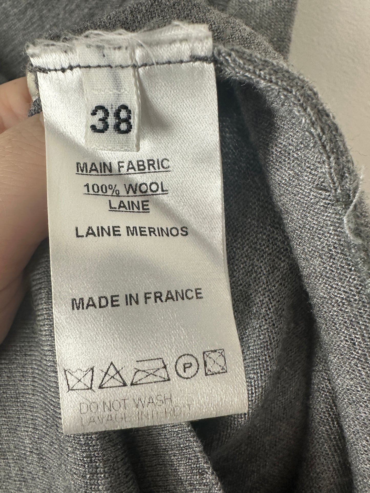 Clothing label on a gray fabric background