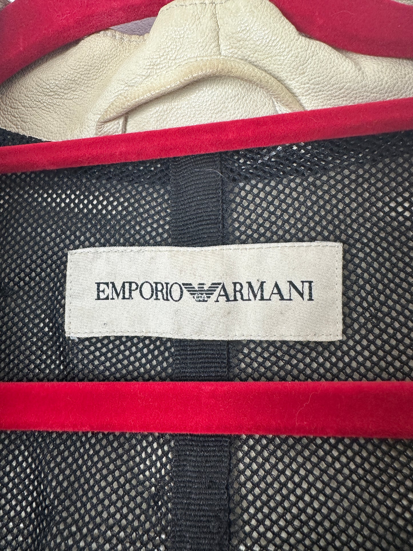 Close-up of Emporio Armani label on a textured fabric background