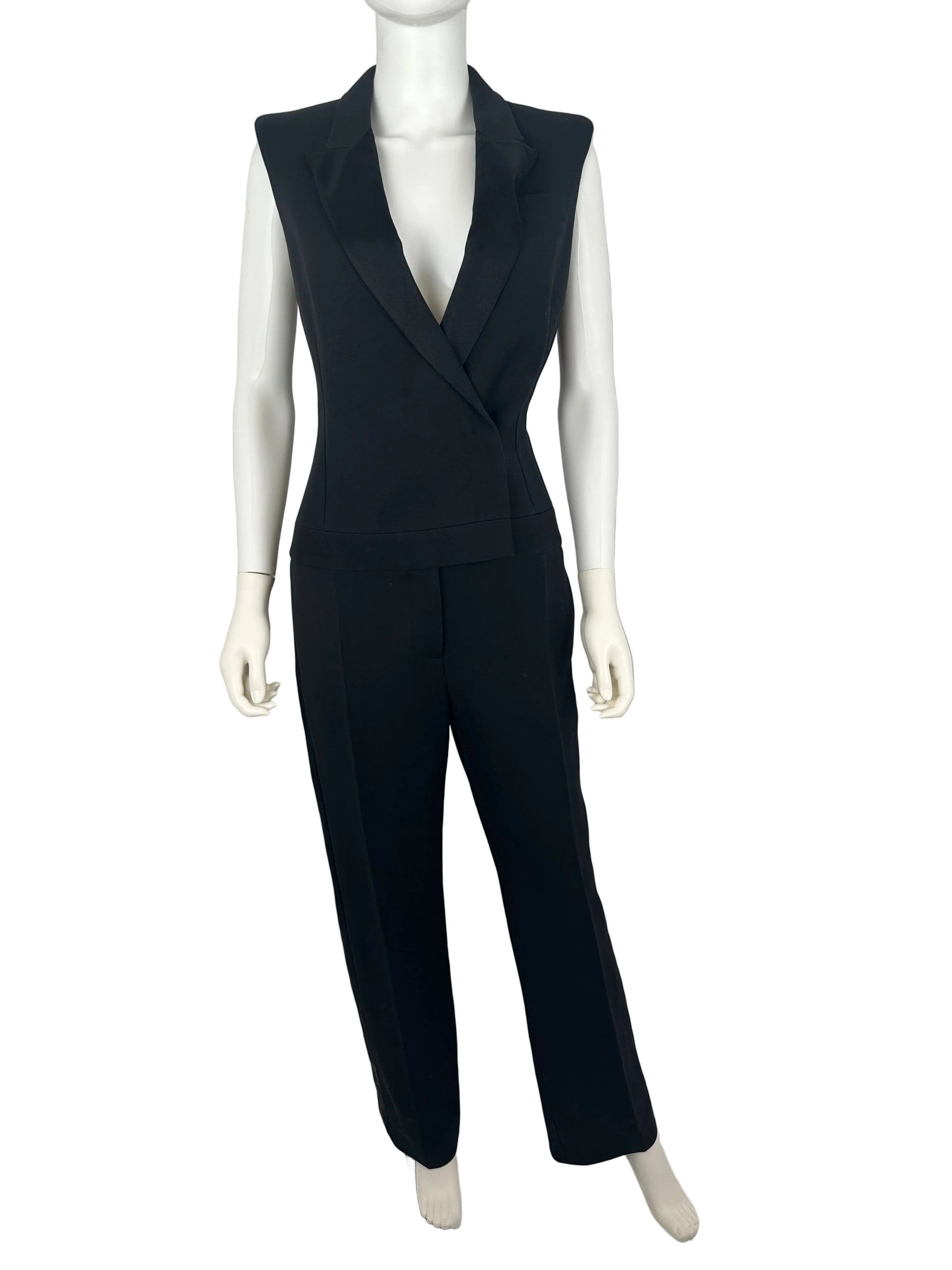 Black jumpsuit on a mannequin against a plain background