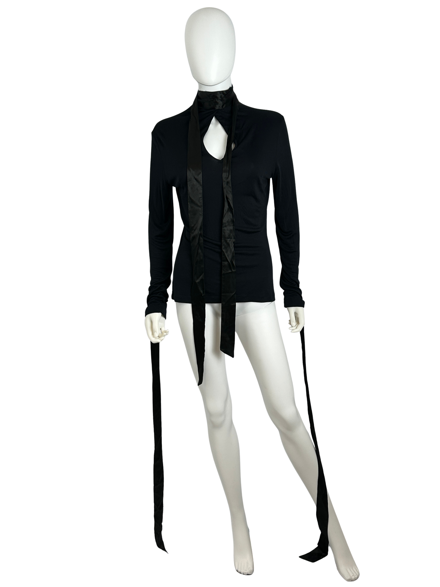 Black top with long ribbons on a white mannequin
