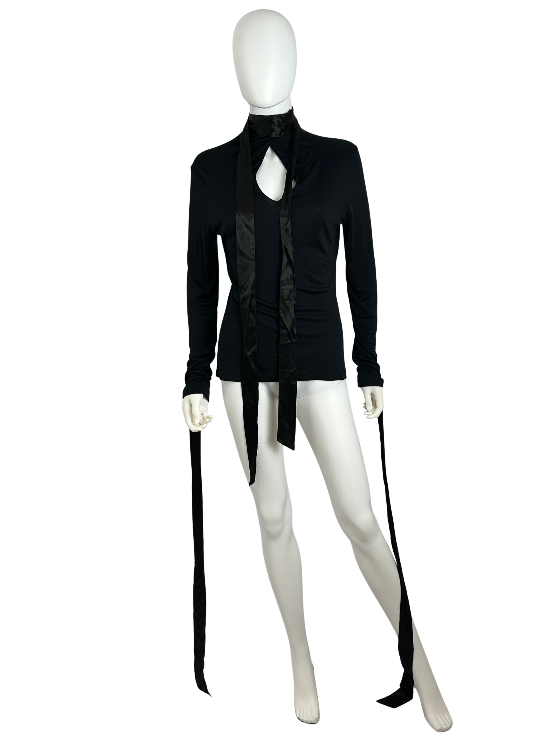 Black top with long ribbons on a white mannequin