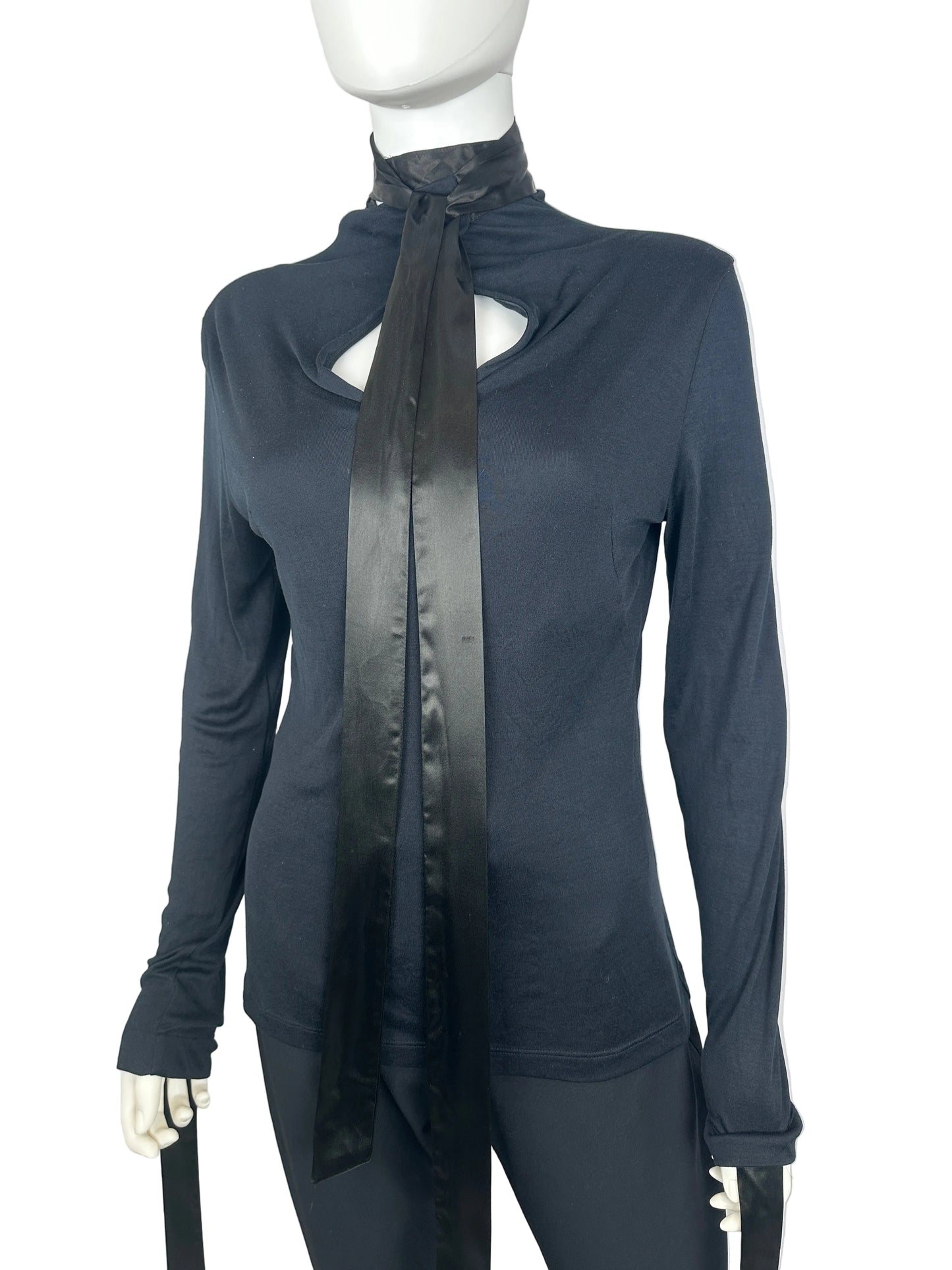 Mannequin wearing a dark blue outfit with a belt on a white background
