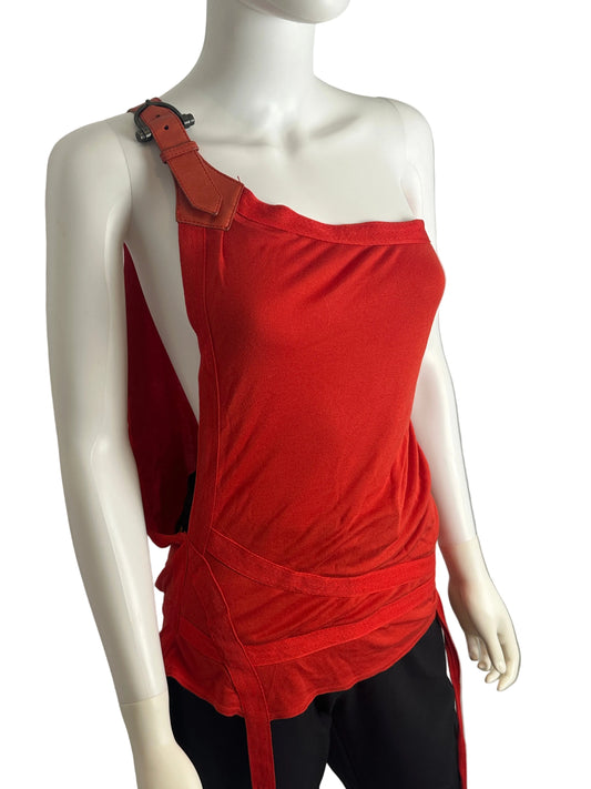 Mannequin wearing a red outfit with a belt on a plain background