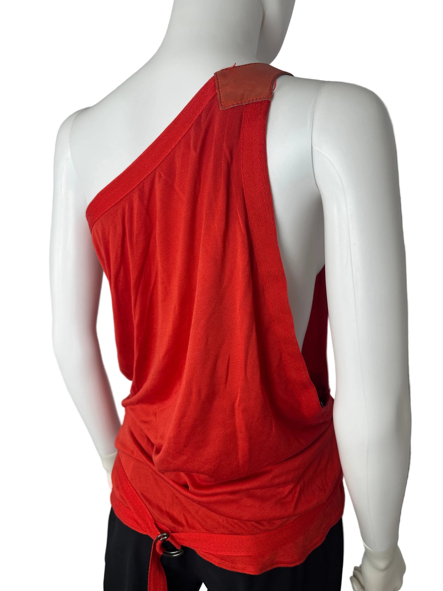 Mannequin wearing a red skirt with a white background