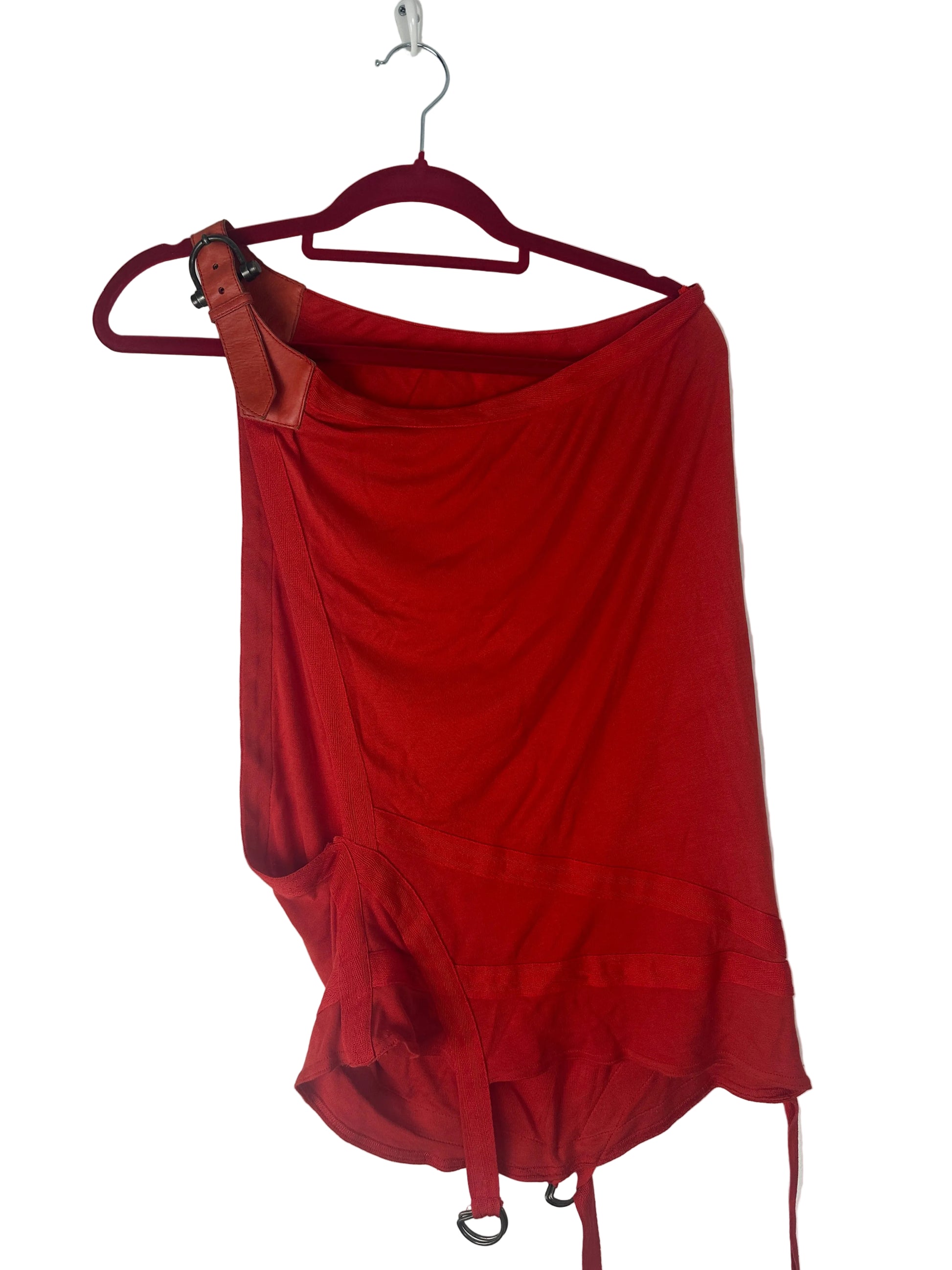 Red top on a hanger against a white background