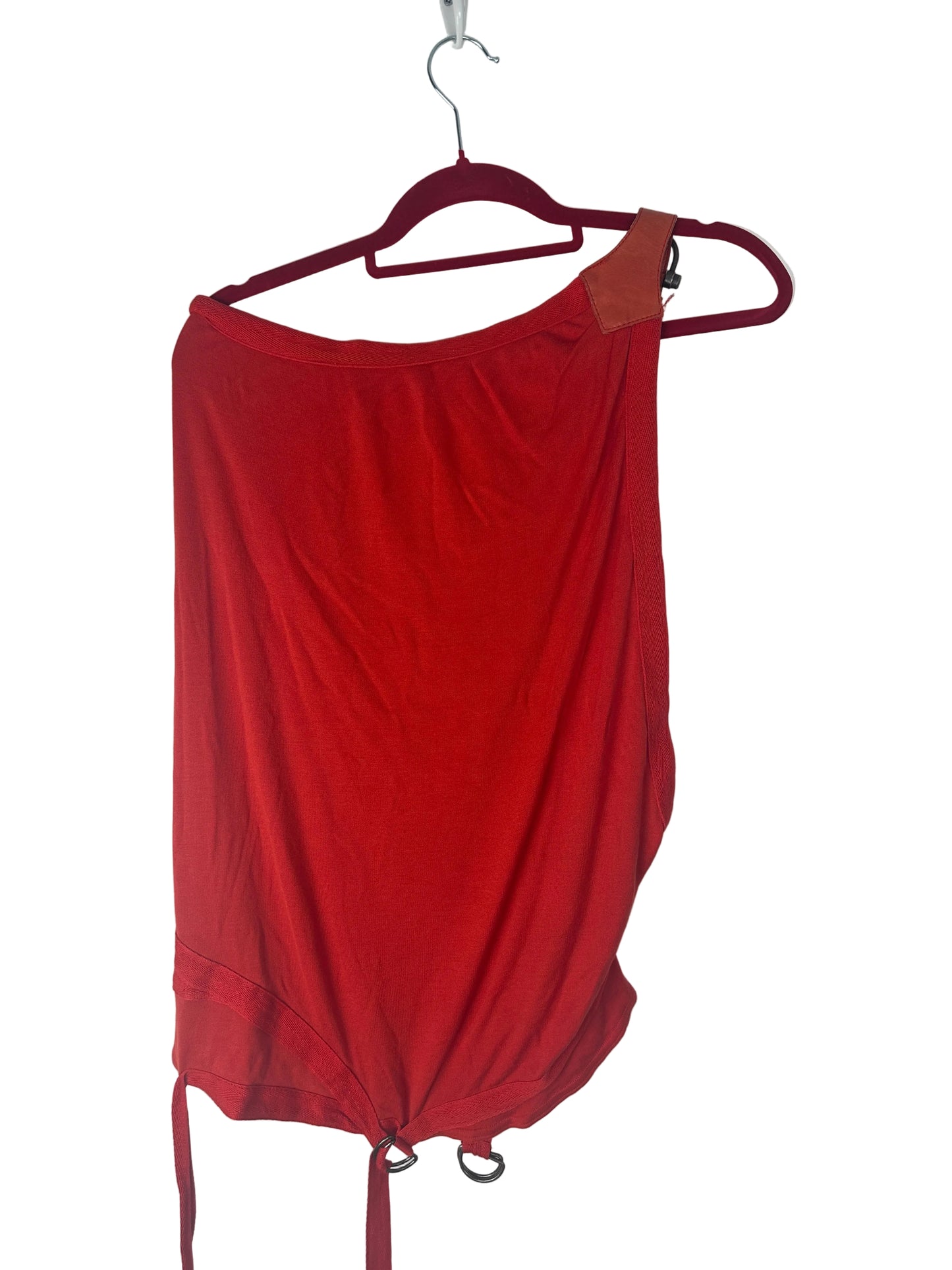 Red top on a hanger against a white background
