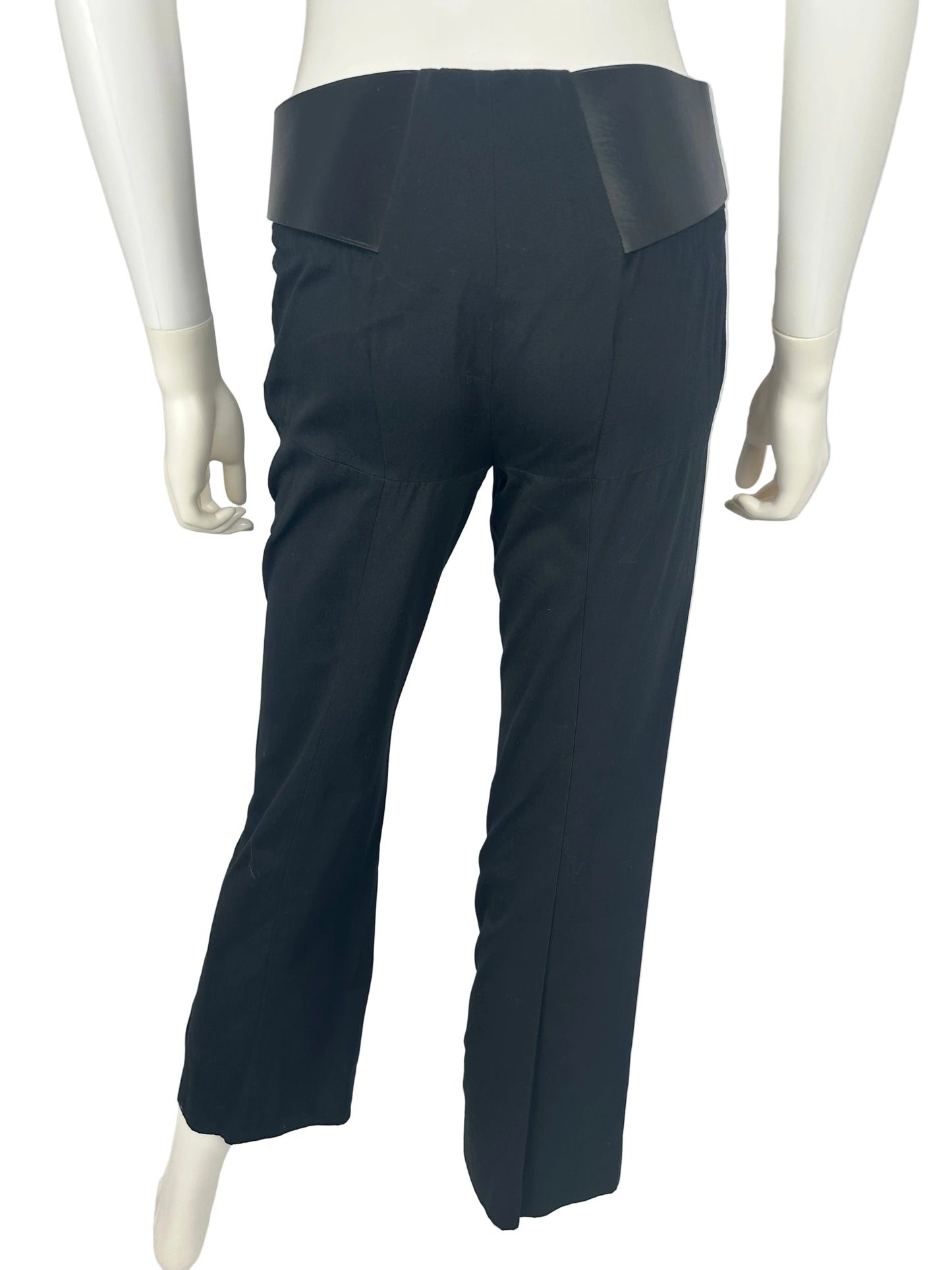 Black pants on a white mannequin against a light gray background