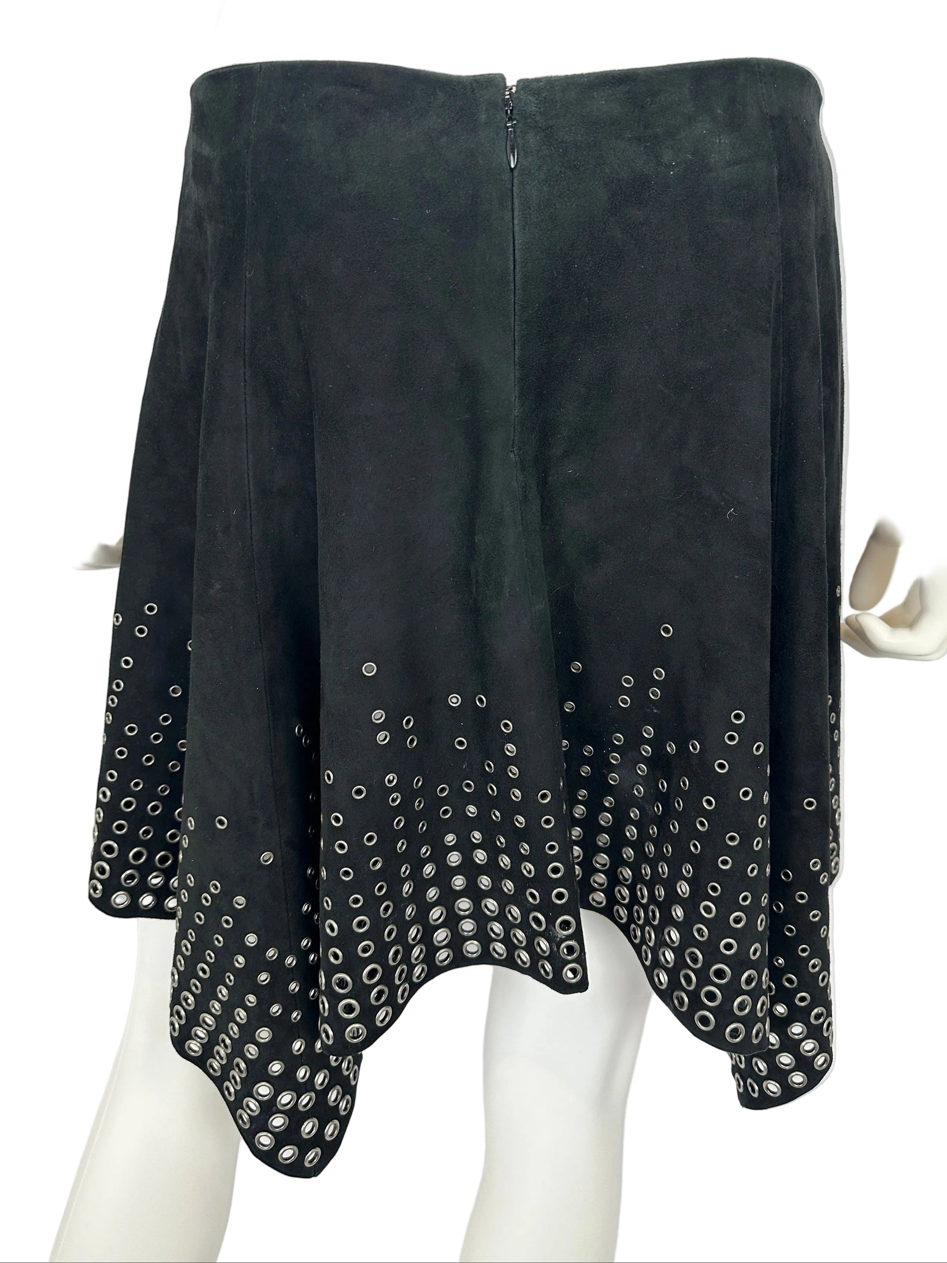 Black suede skirt with rhinestone embellishments on a mannequin against a white background
