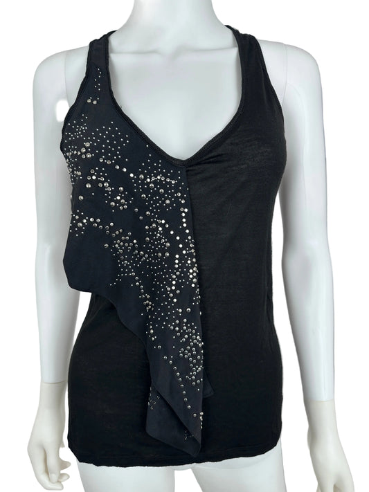 Black top with stud details on a mannequin against a neutral background