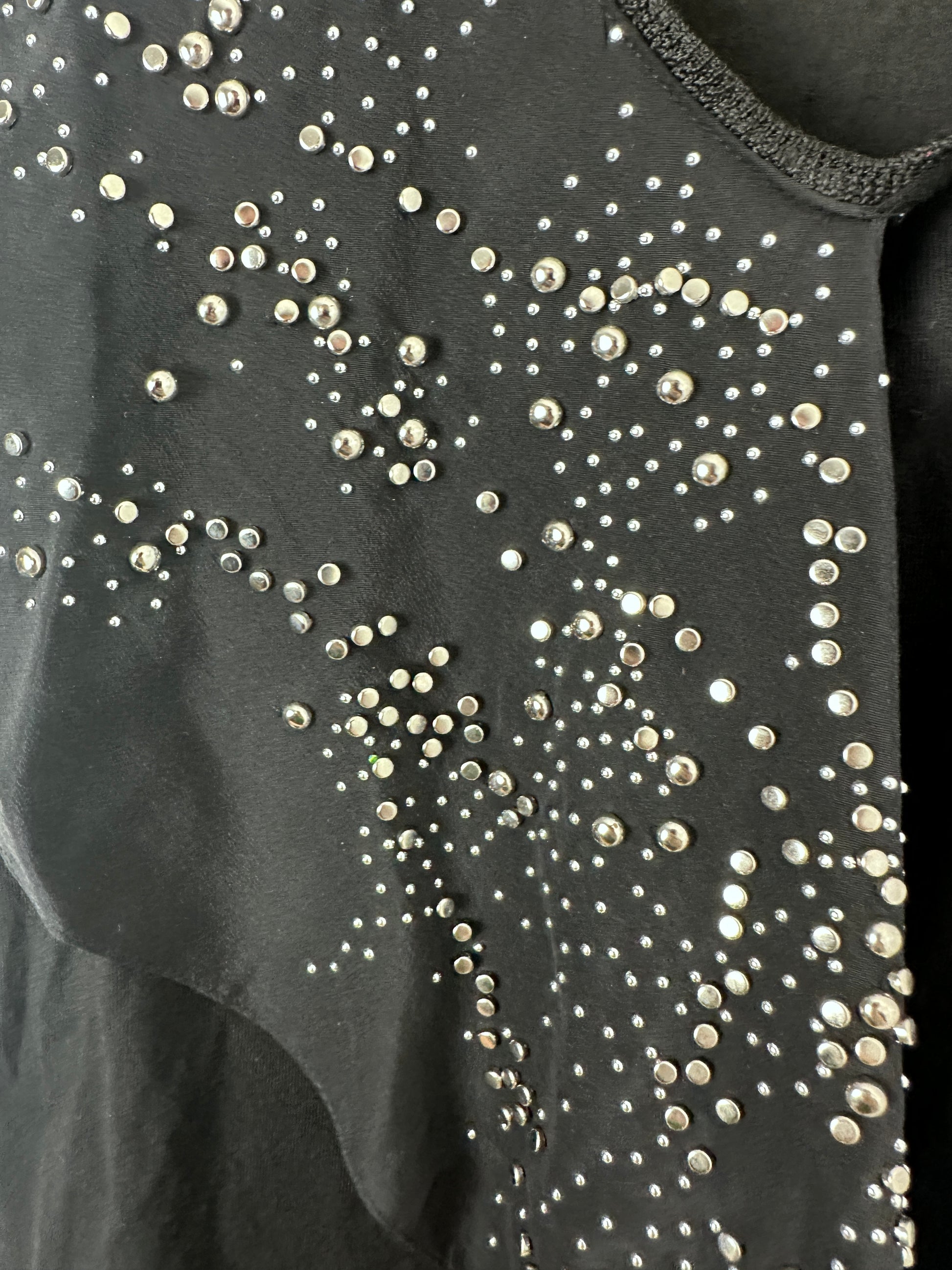 Black fabric with scattered silver rhinestones