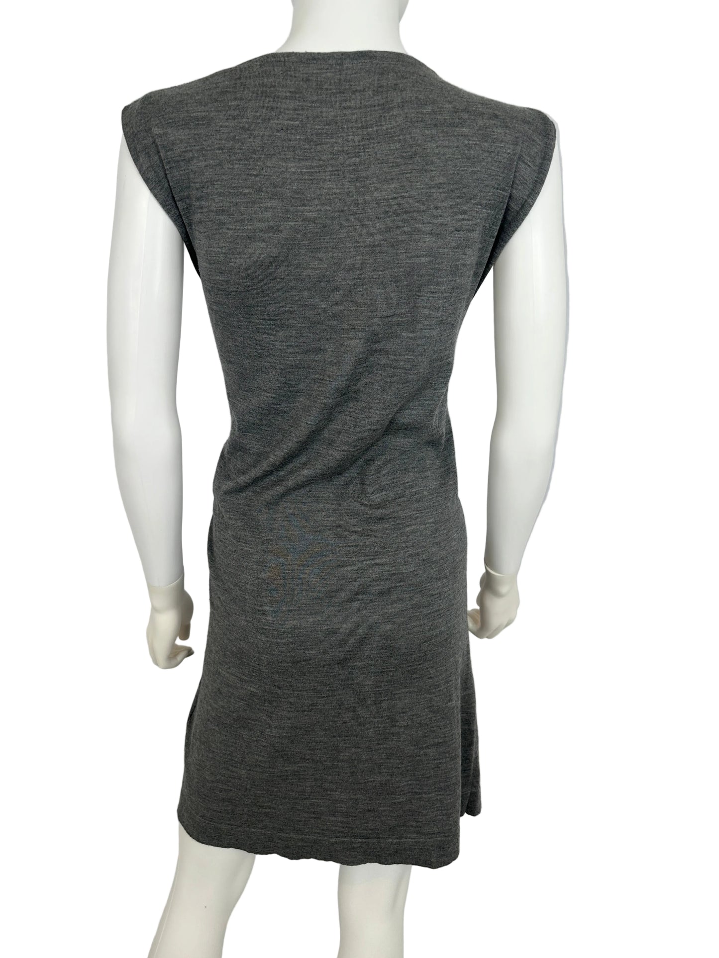 Gray dress on a white mannequin against a plain background