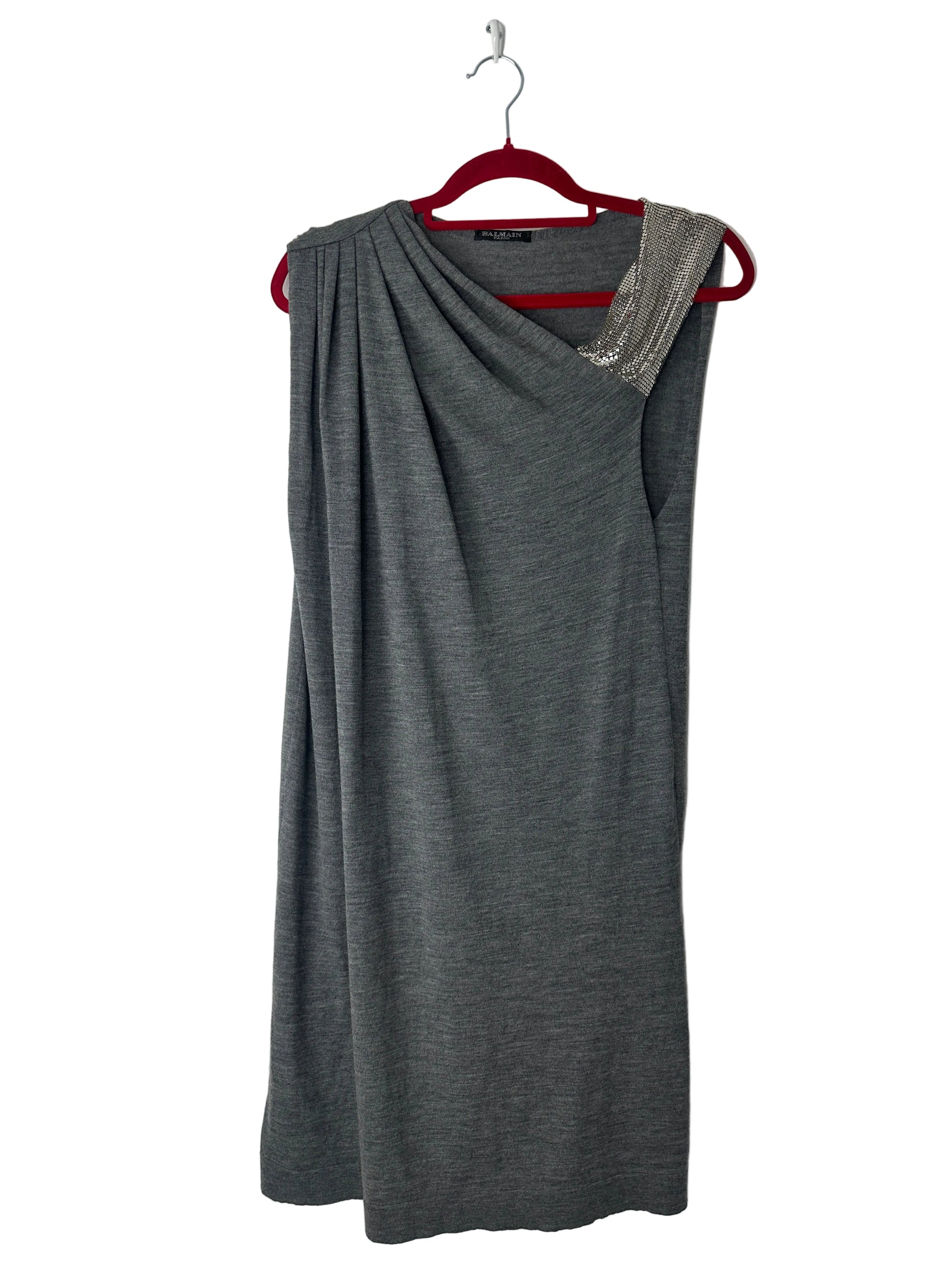Gray dress on a hanger against a white background