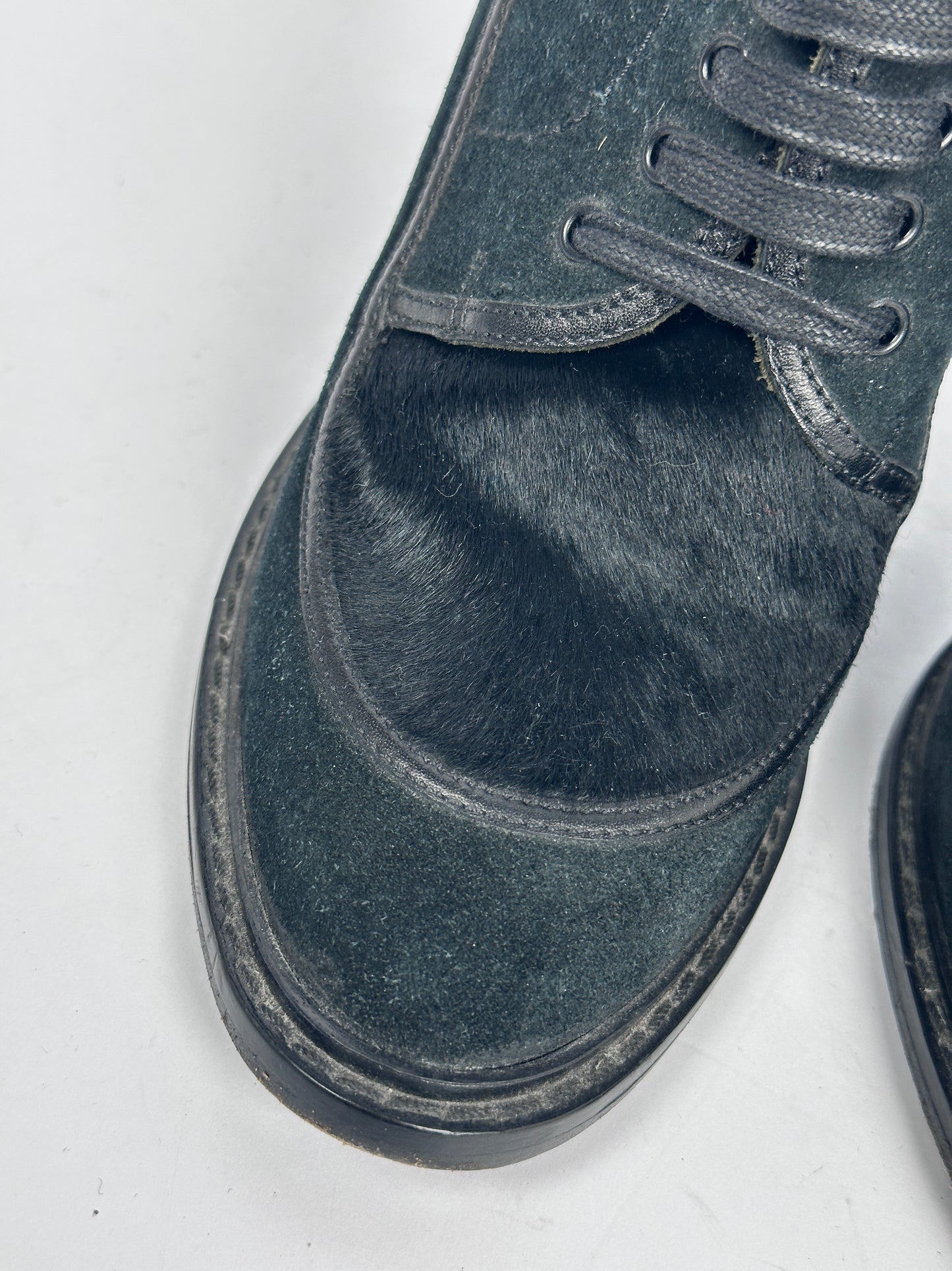 Close-up of a black shoe on a white background