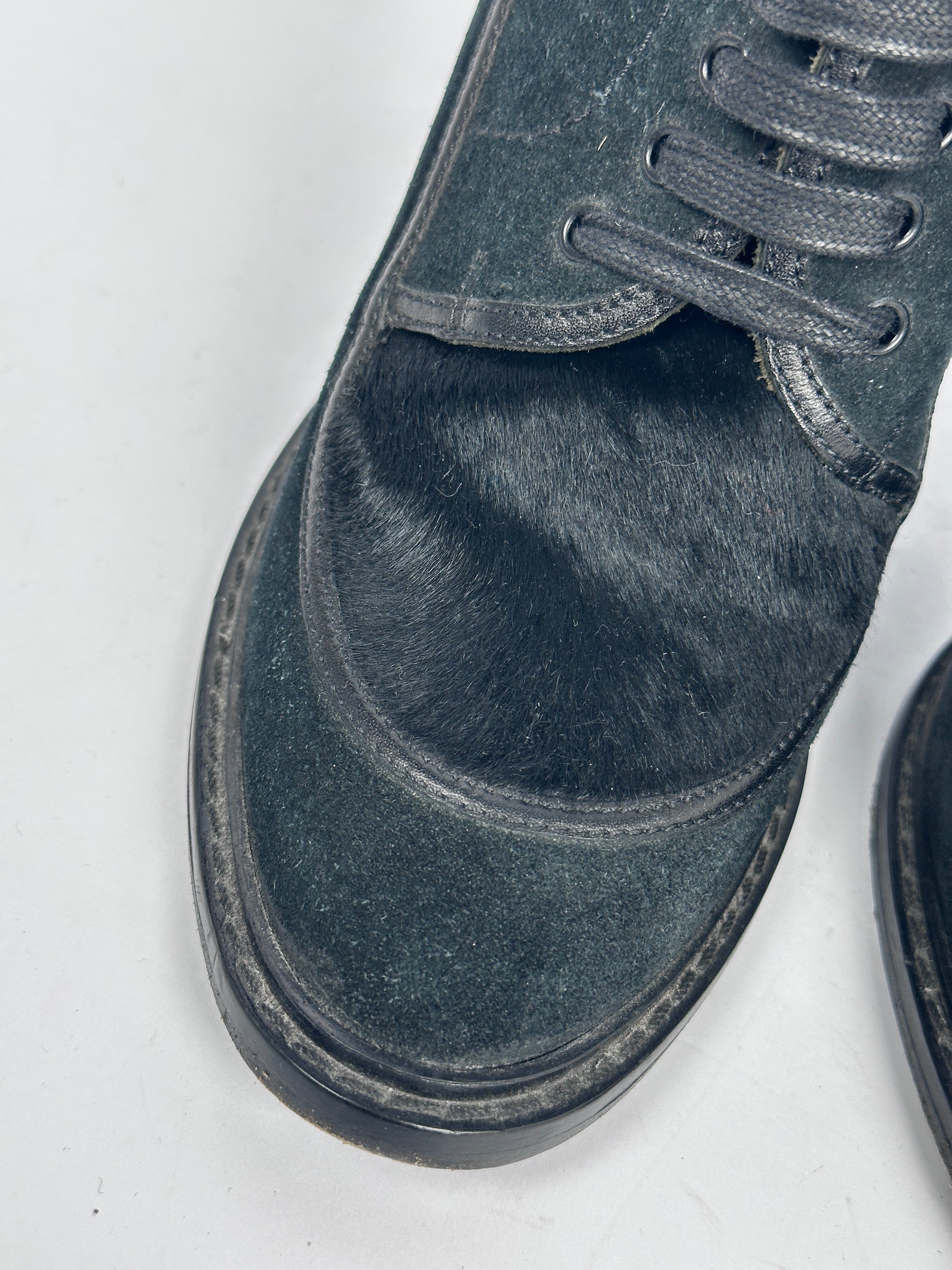 Close-up of a black shoe on a white background