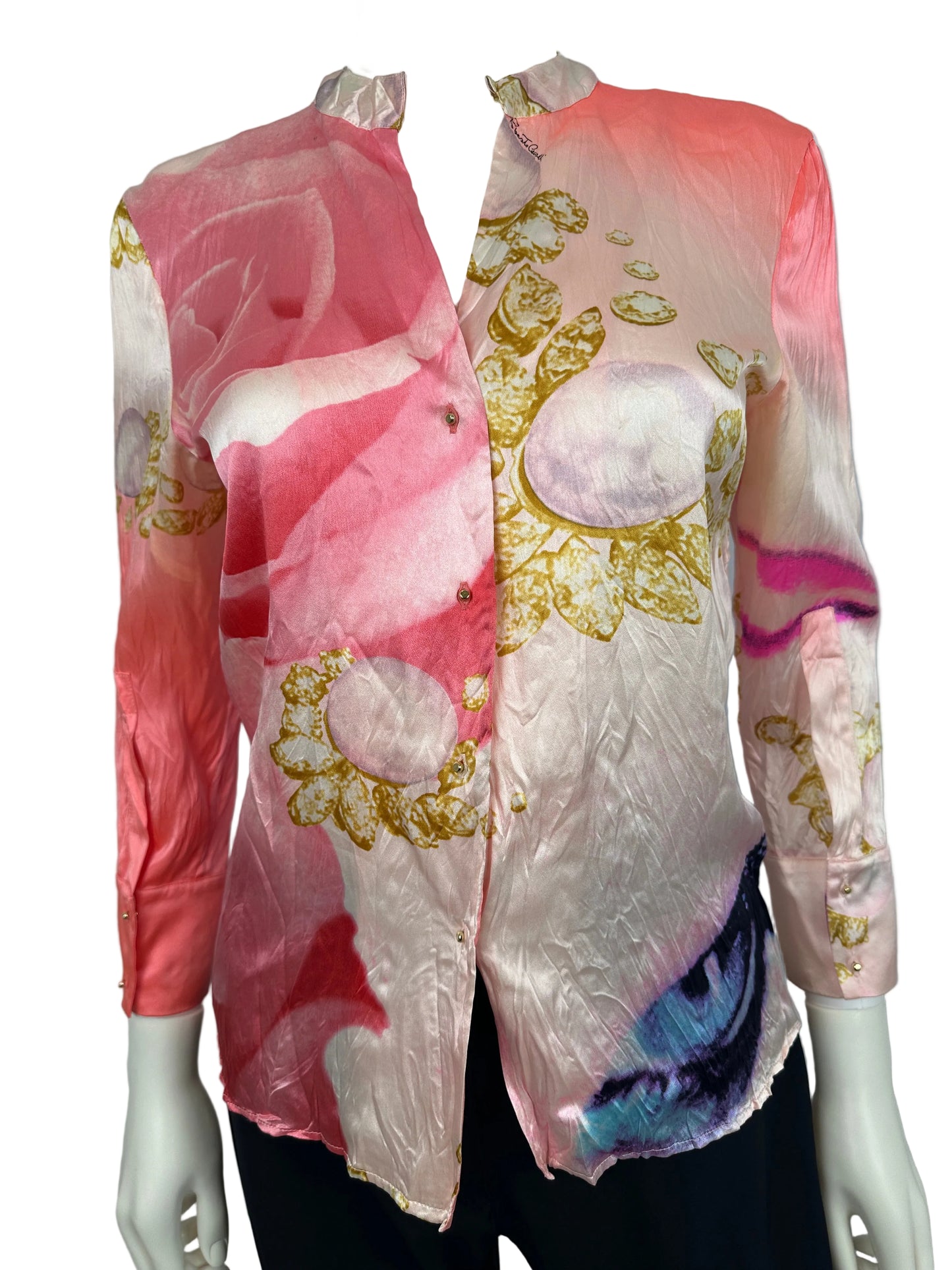 Mannequin wearing a colorful outfit with floral patterns on a plain background