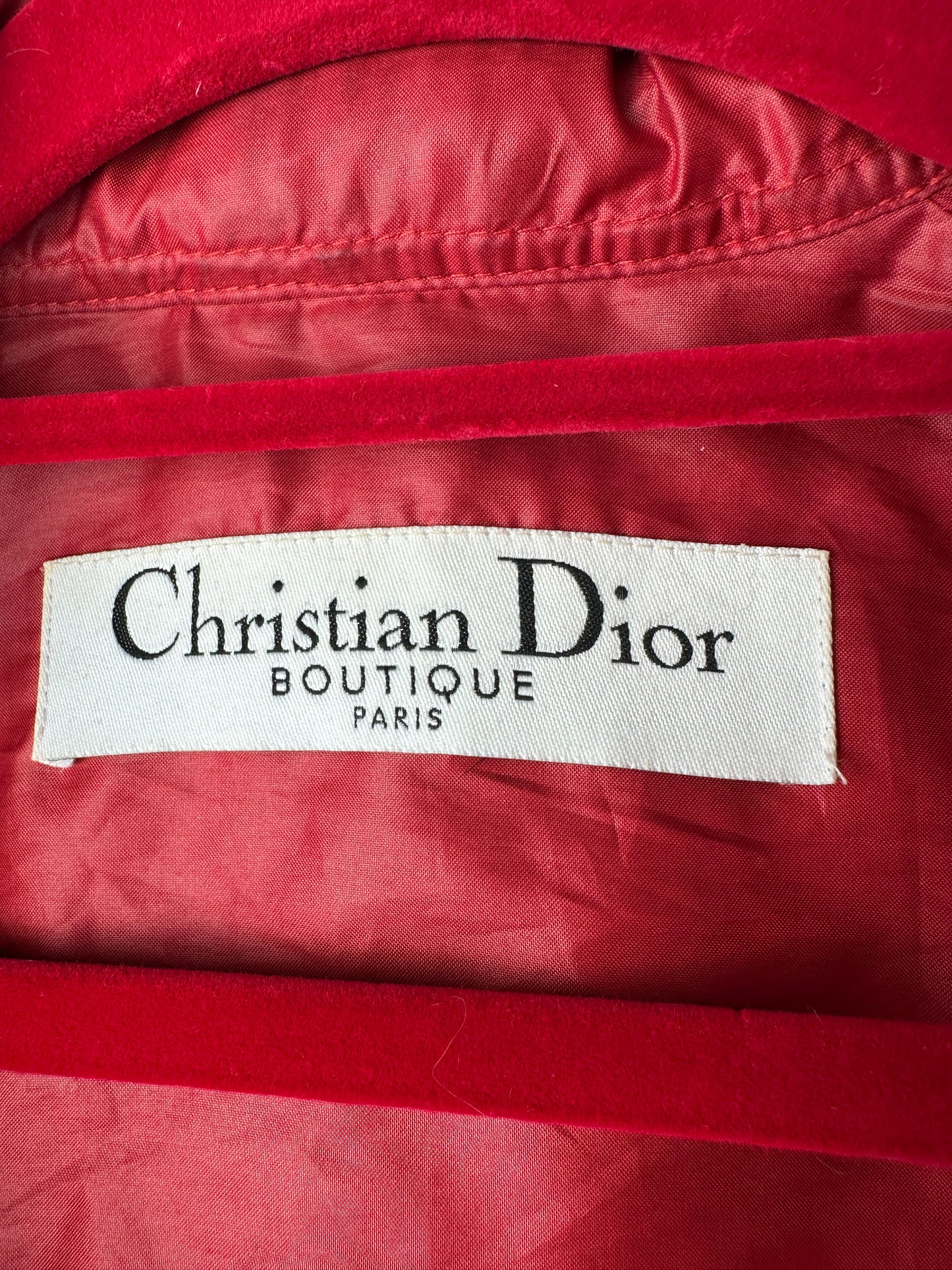 Christian Dior label on a red garment