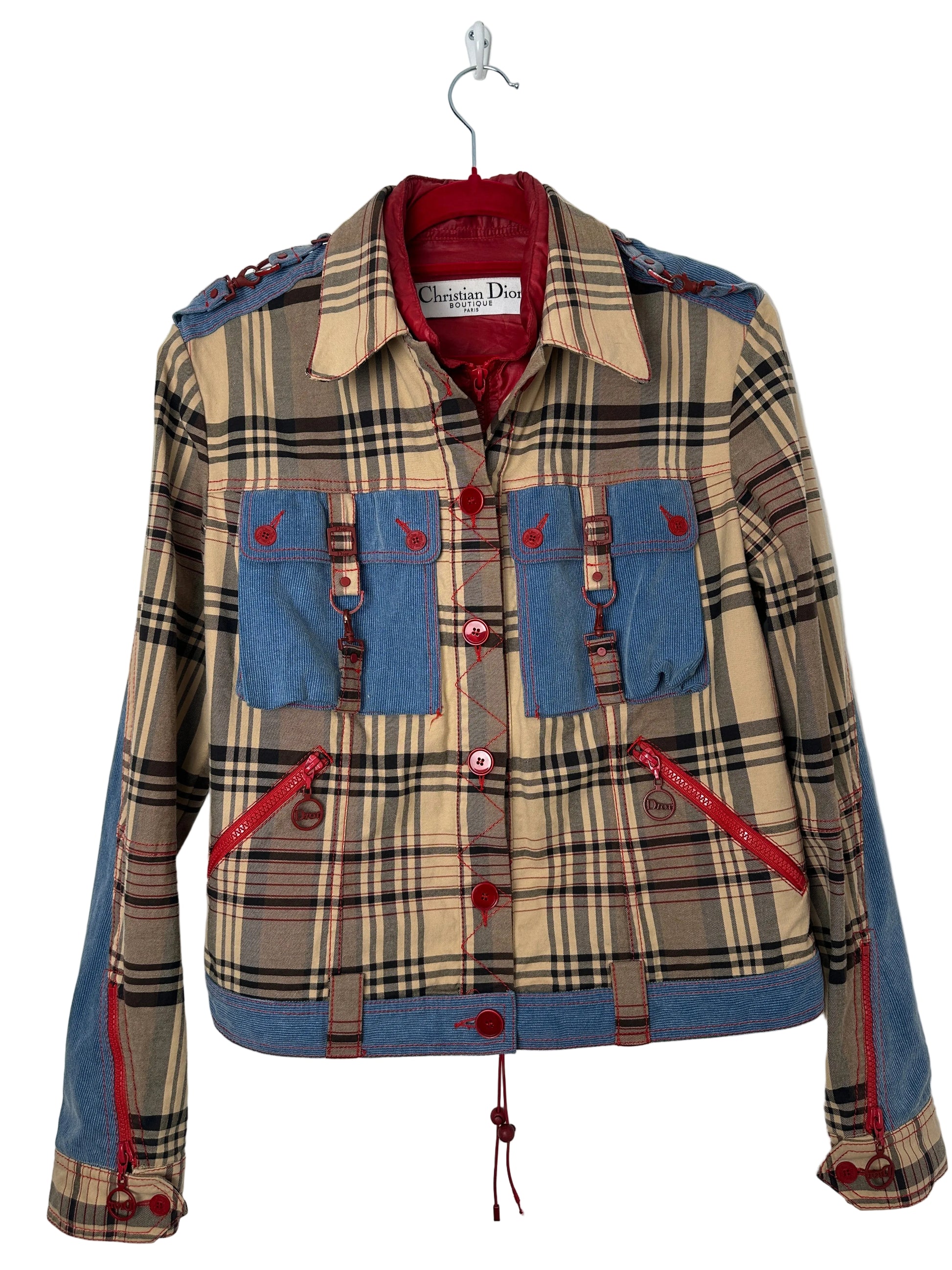 Plaid and denim trucker jacket on a red hanger