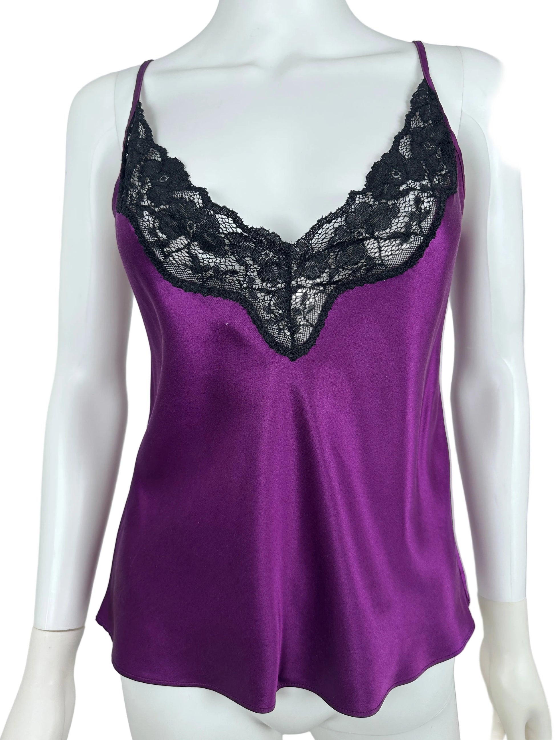 Purple top with black lace details on a mannequin against a white background