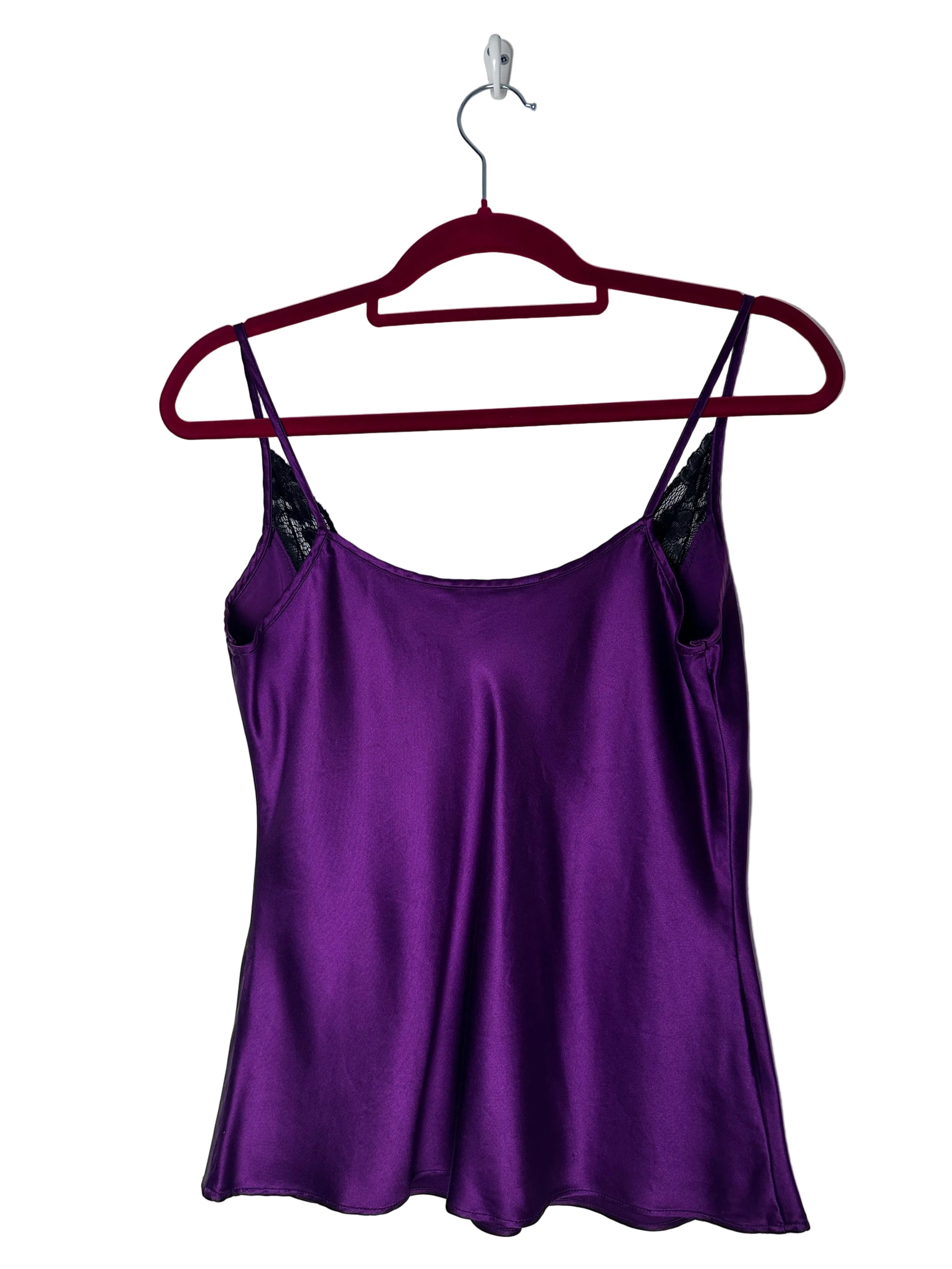 Purple dress on a hanger against a white background