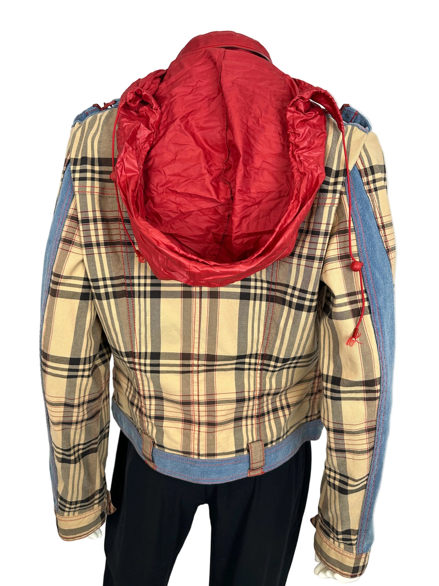 Plaid jacket with a red inner lining on a plain background
