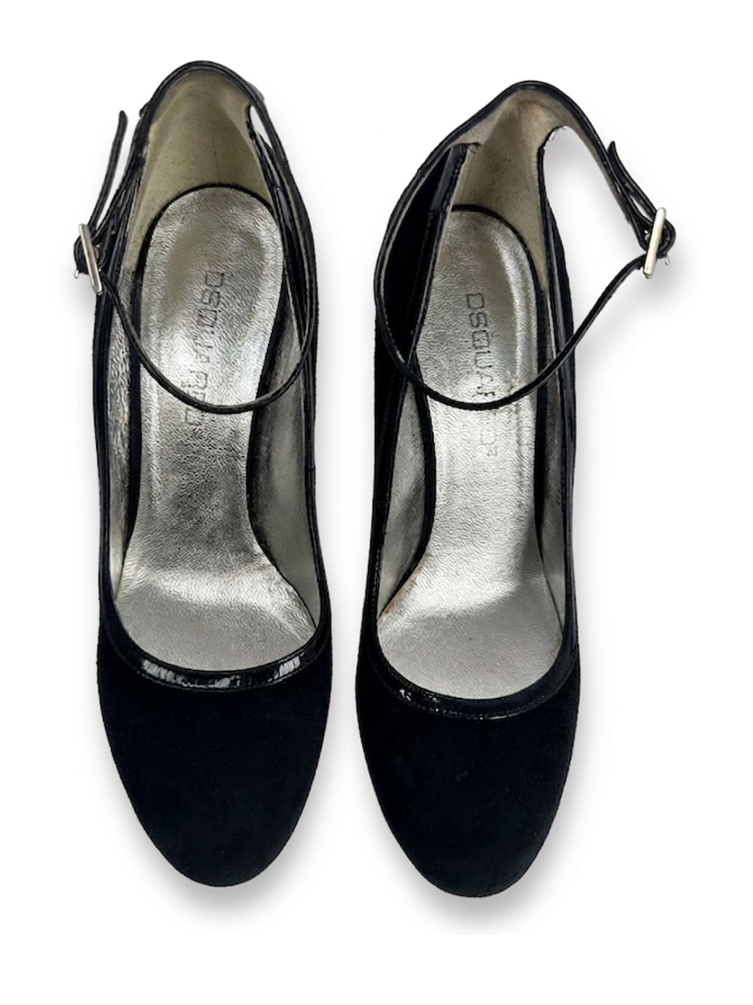 Black high-heeled shoes with a slingback design on a white background