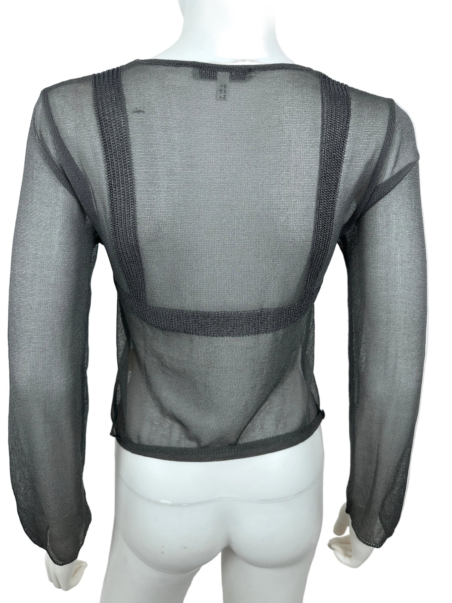 Mannequin wearing a sheer black garment with mesh design on a white background