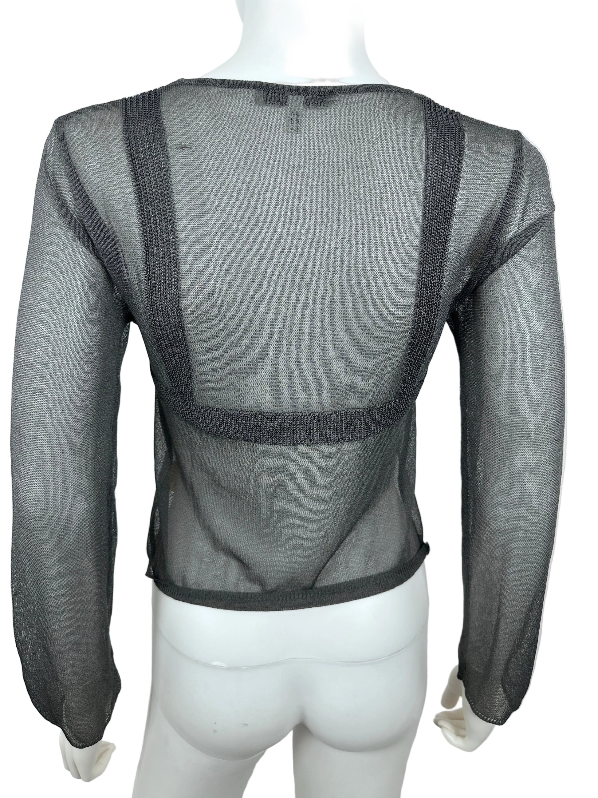 Mannequin wearing a sheer black garment with mesh design on a white background