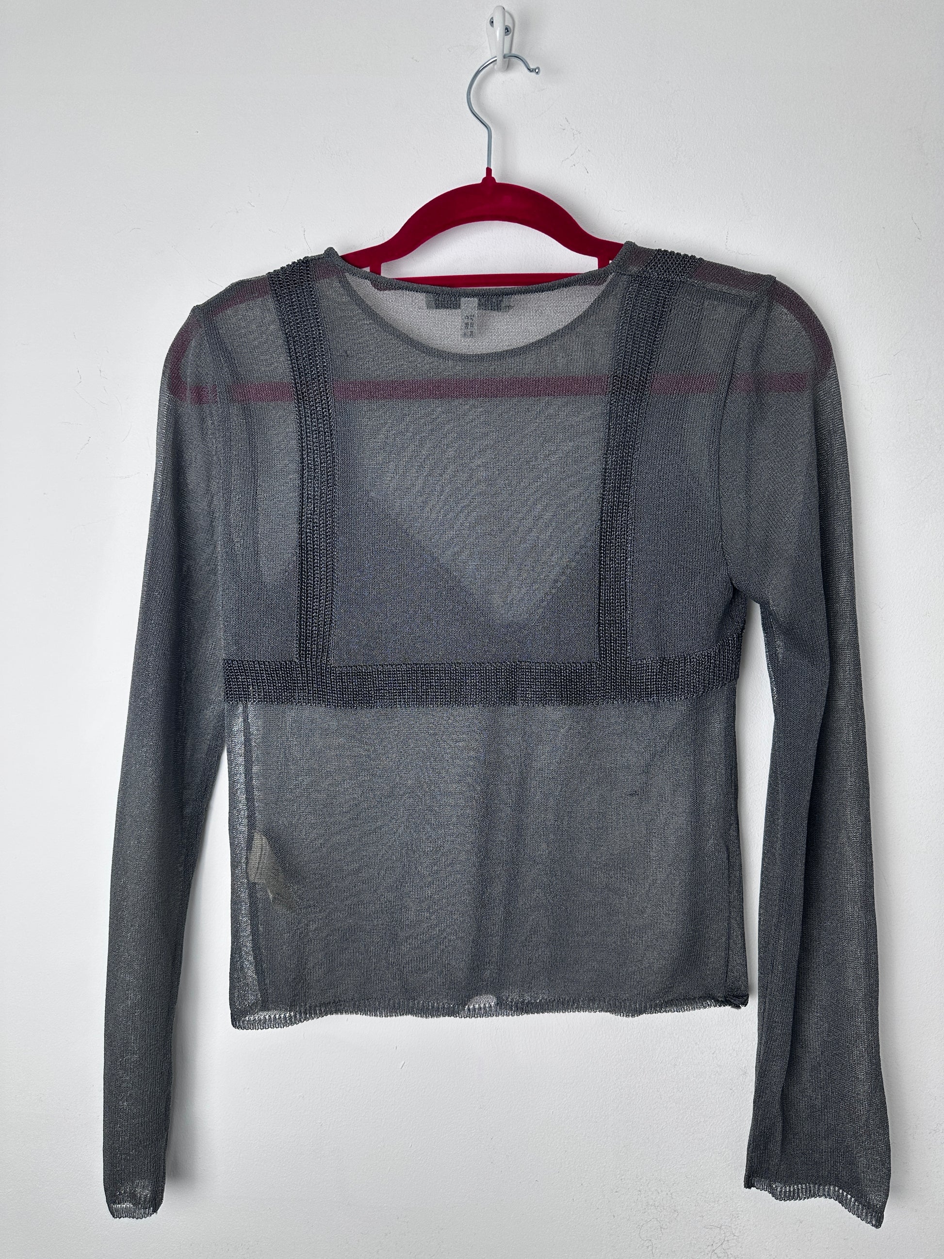 Gray mesh shirt on a hanger with a white background