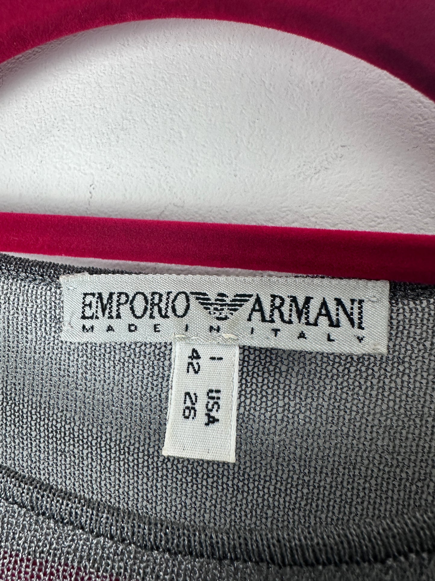 Close-up of Emporio Armani label on a garment with size and country of manufacture details.