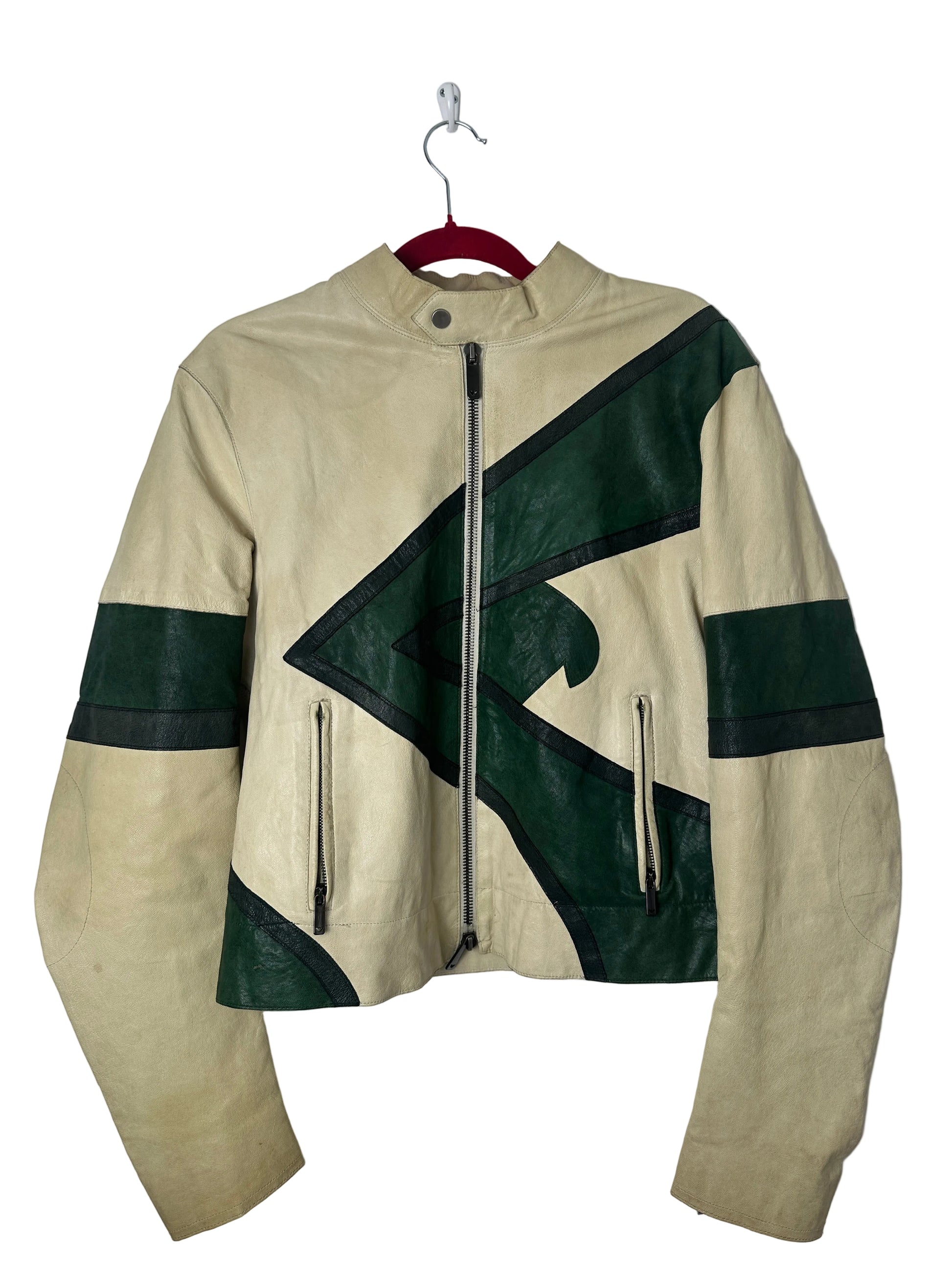 Beige and green jacket on a hanger against a white background