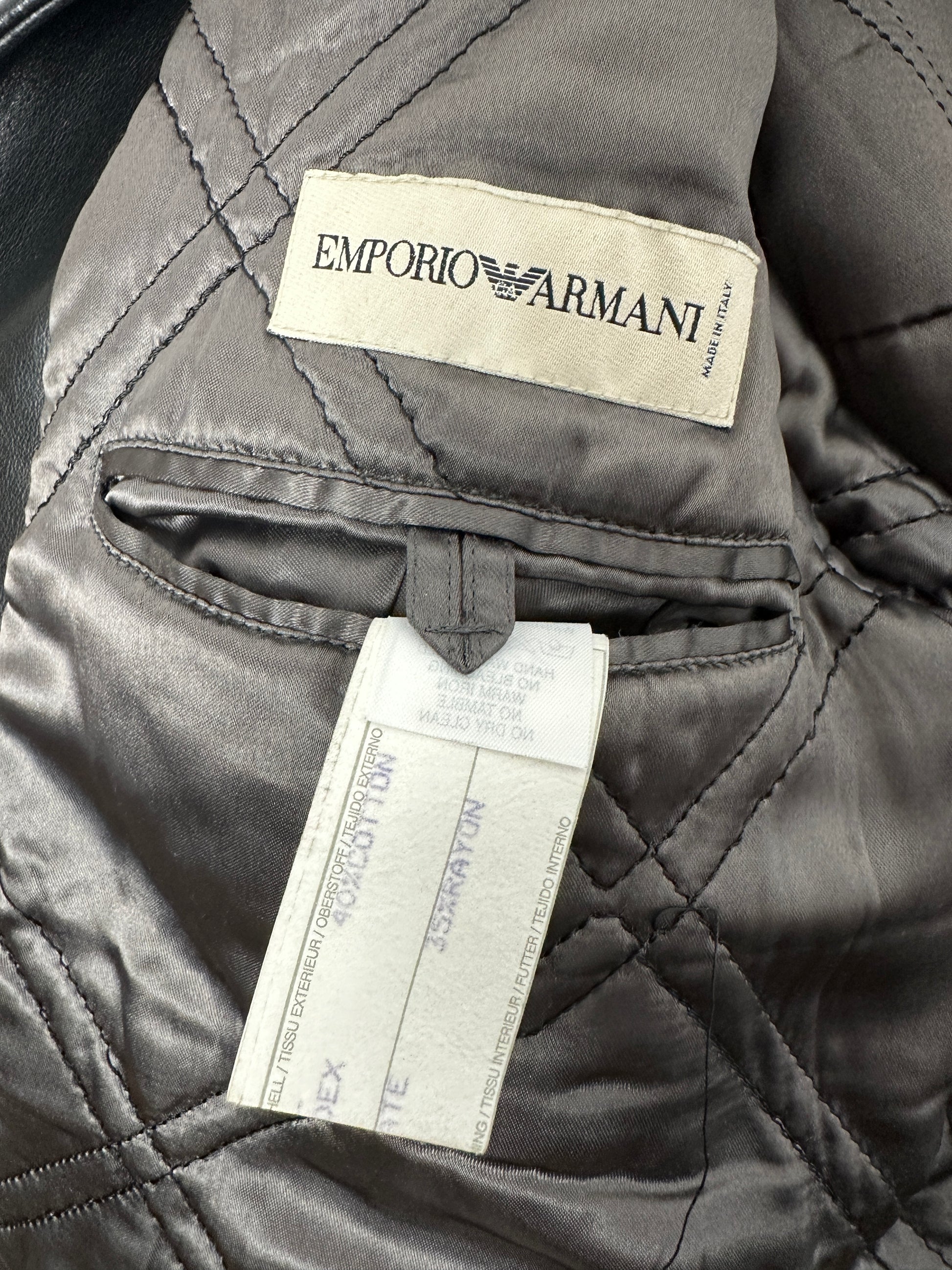 Close-up of a quilted jacket with Emporio Armani label and tag.