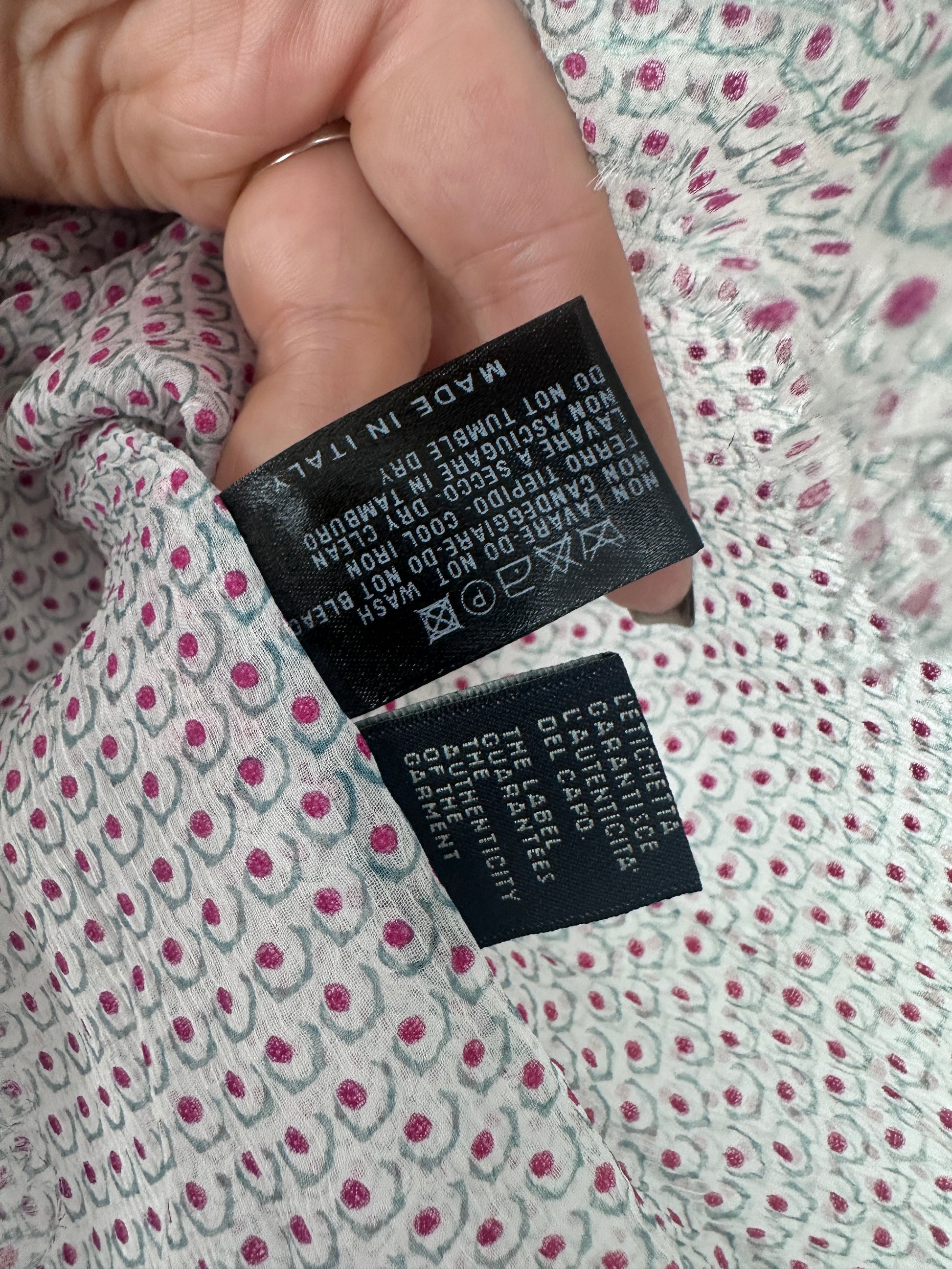 Close up of a care label on a silk gaarment