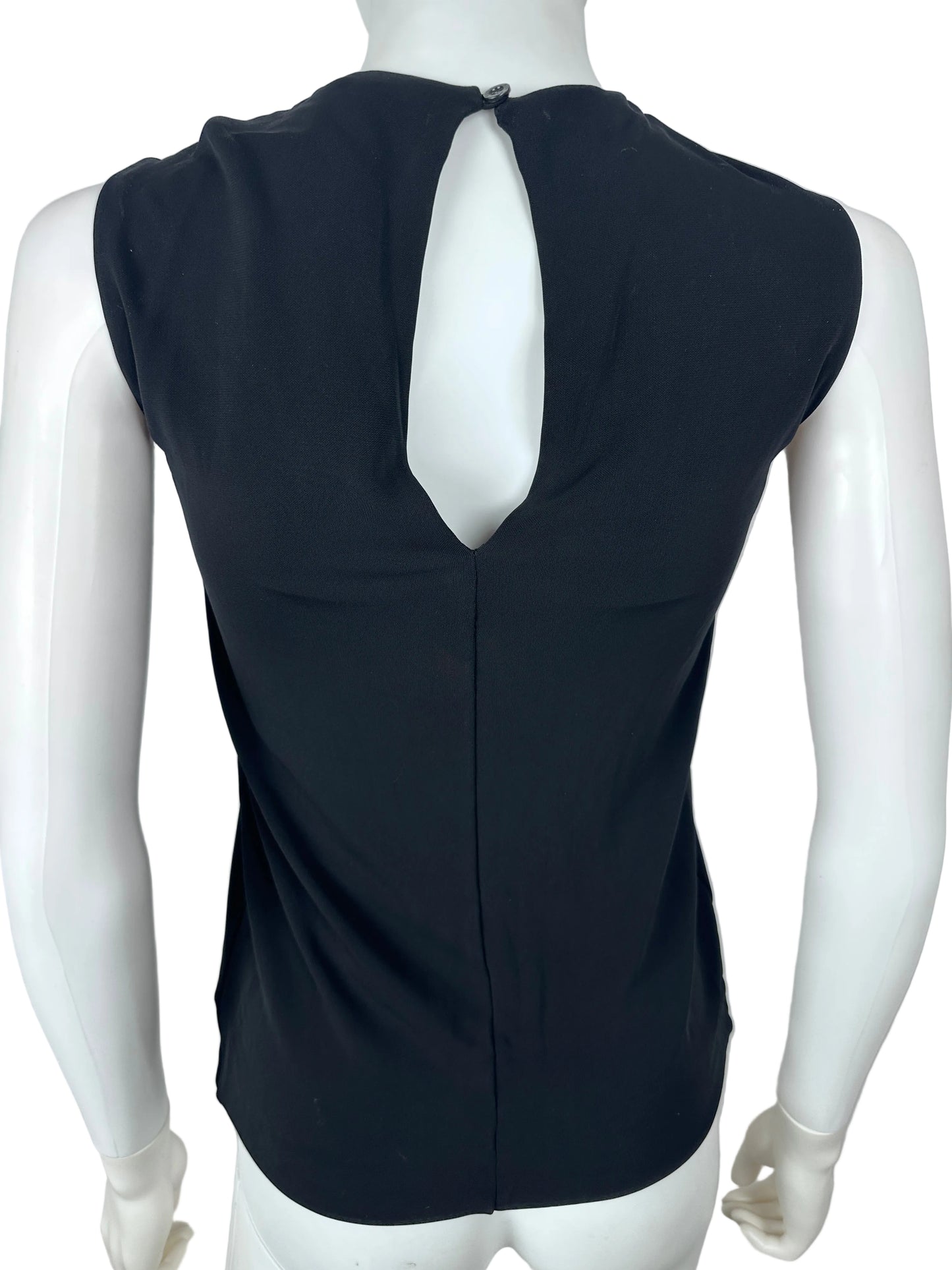 Black sleeveless top on a white mannequin against a plain background