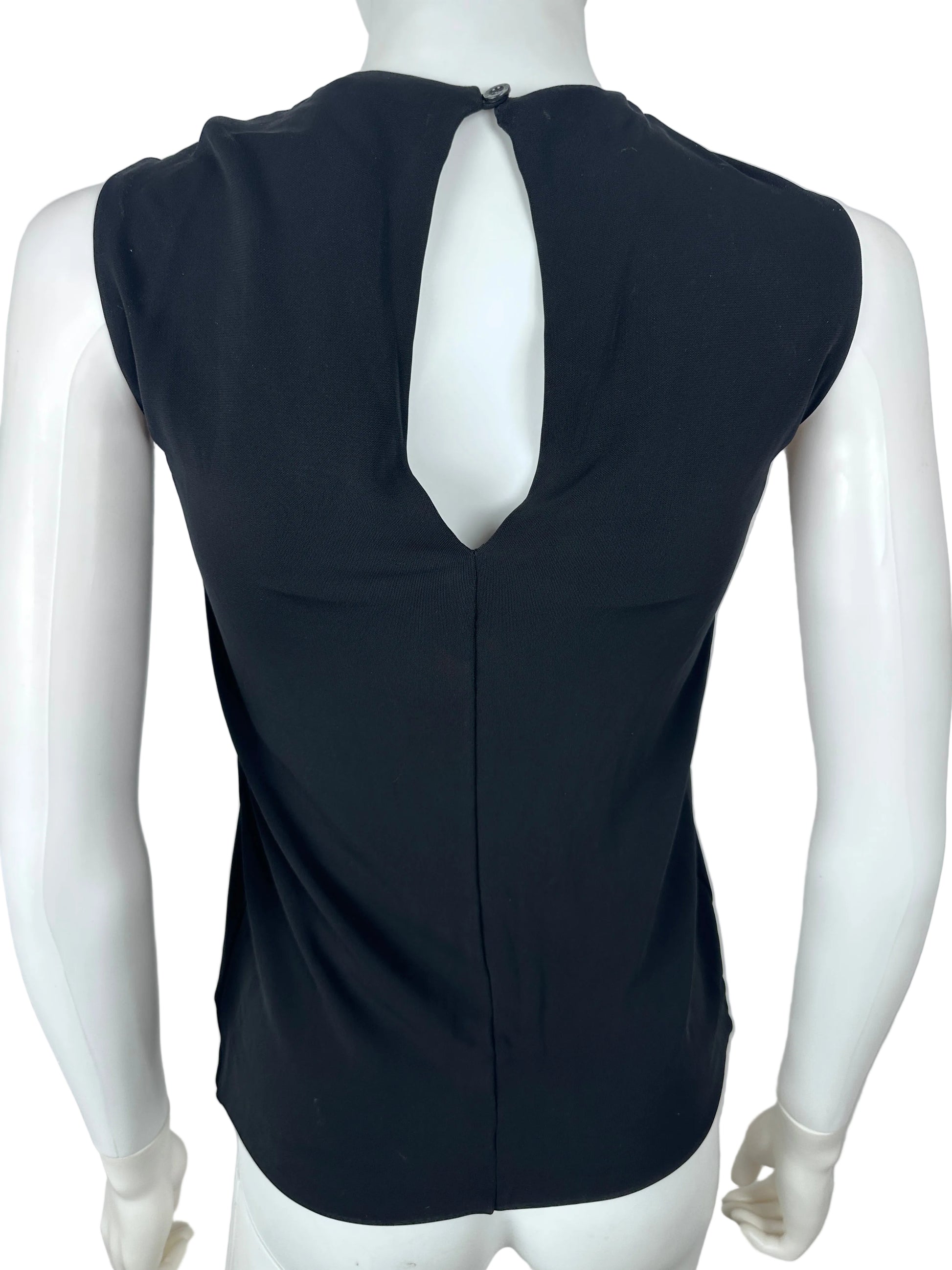 Black sleeveless top on a white mannequin against a plain background