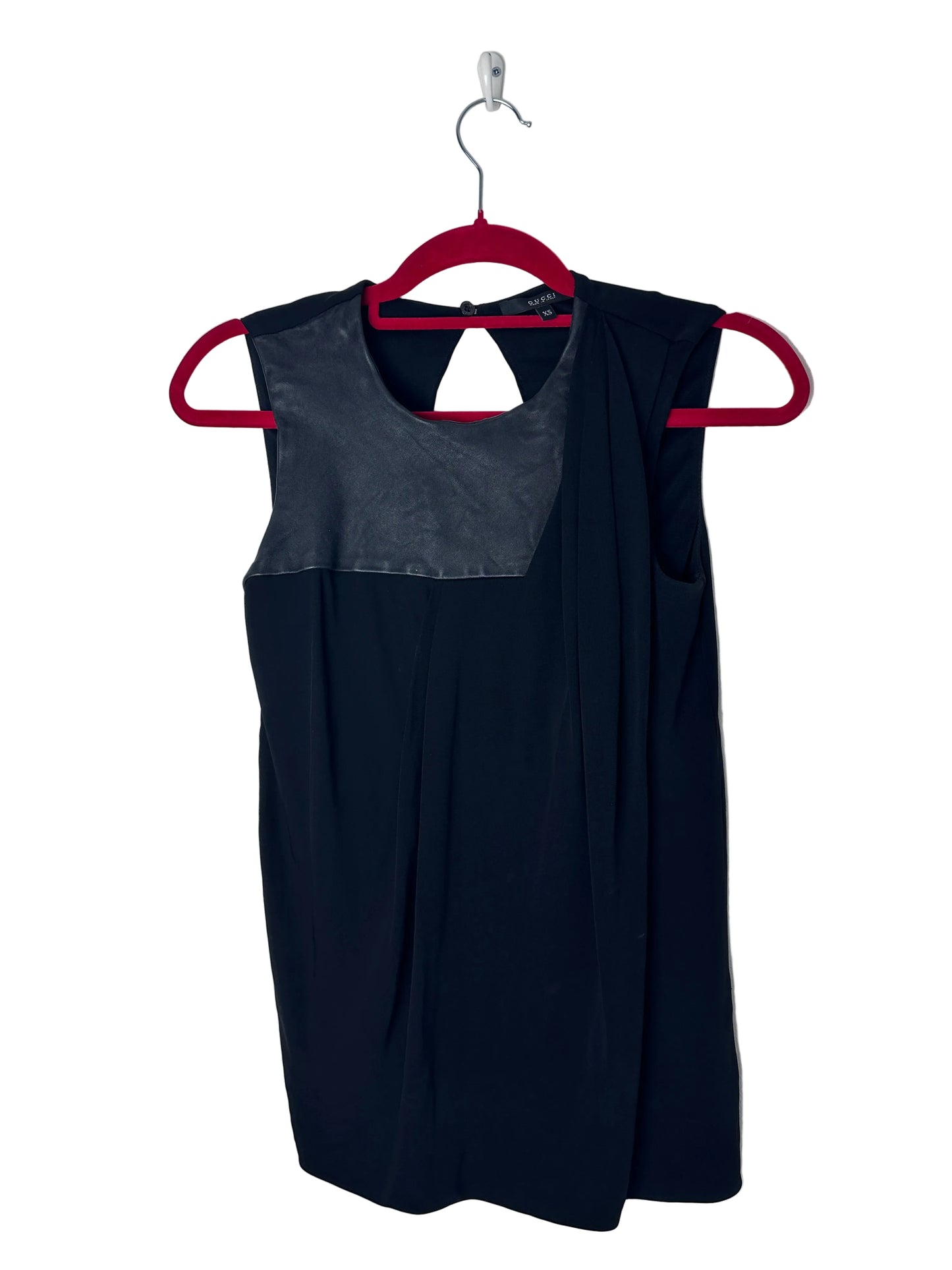 Black top with red hanger on a white background