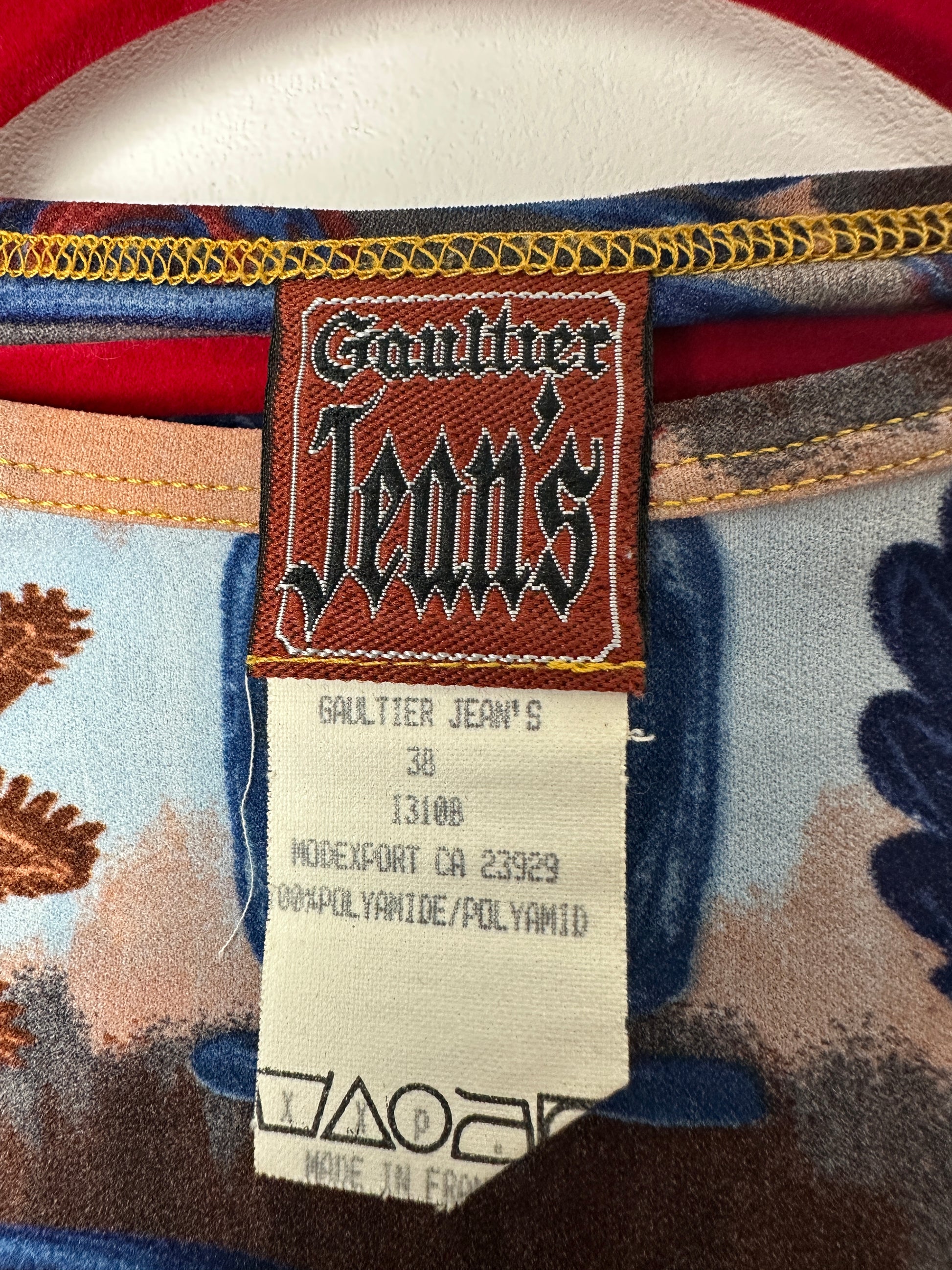 Close-up of a Gant leather label on a patterned fabric background