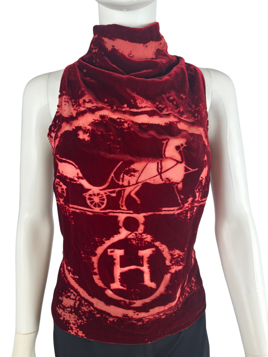 Red patterned sleeveless top on a mannequin against a white background