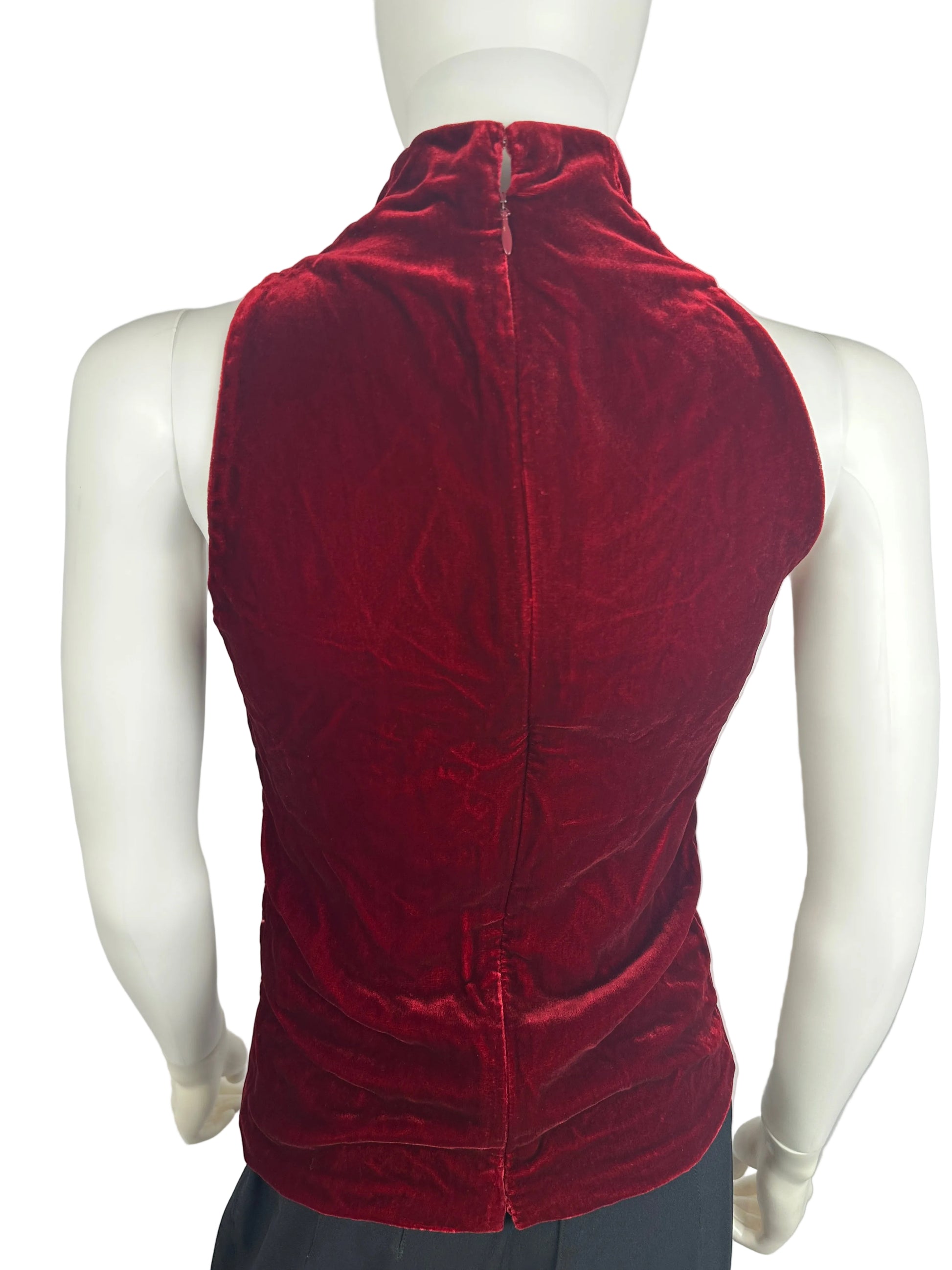 Red velvet skirt on a mannequin against a gray background