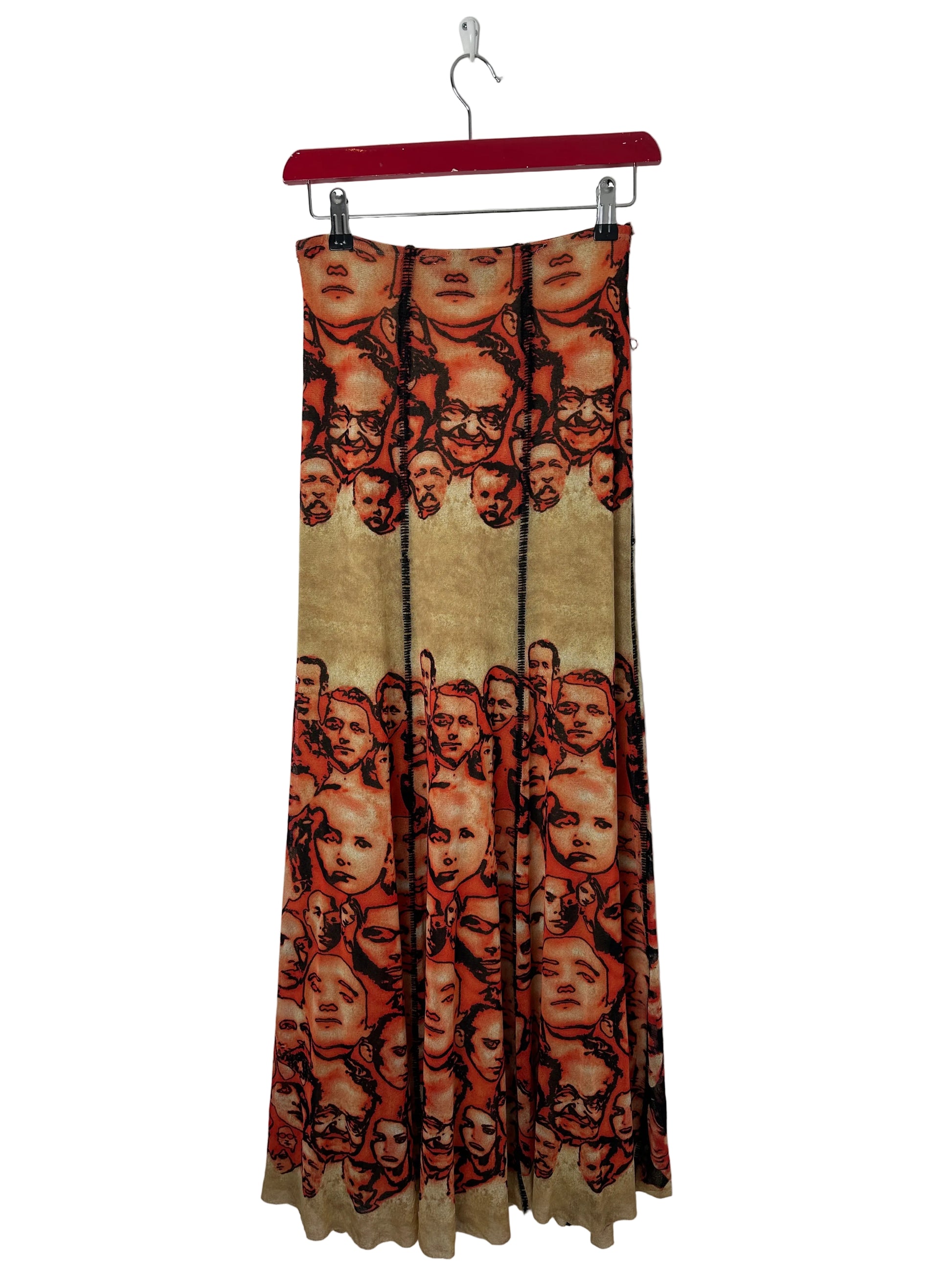 Long skirt with a pattern of faces on a white background