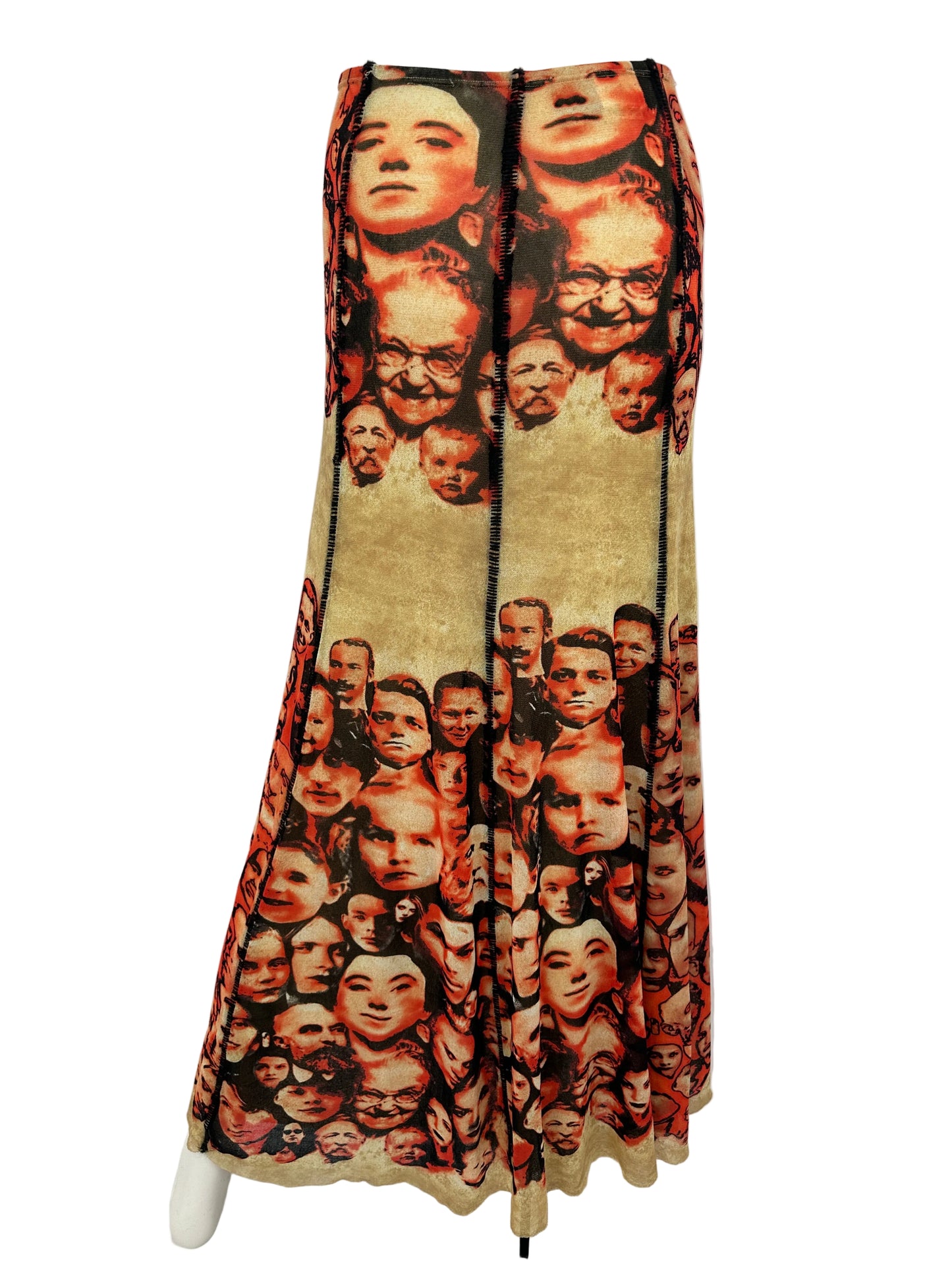 Skirt with a pattern of faces on a white surface