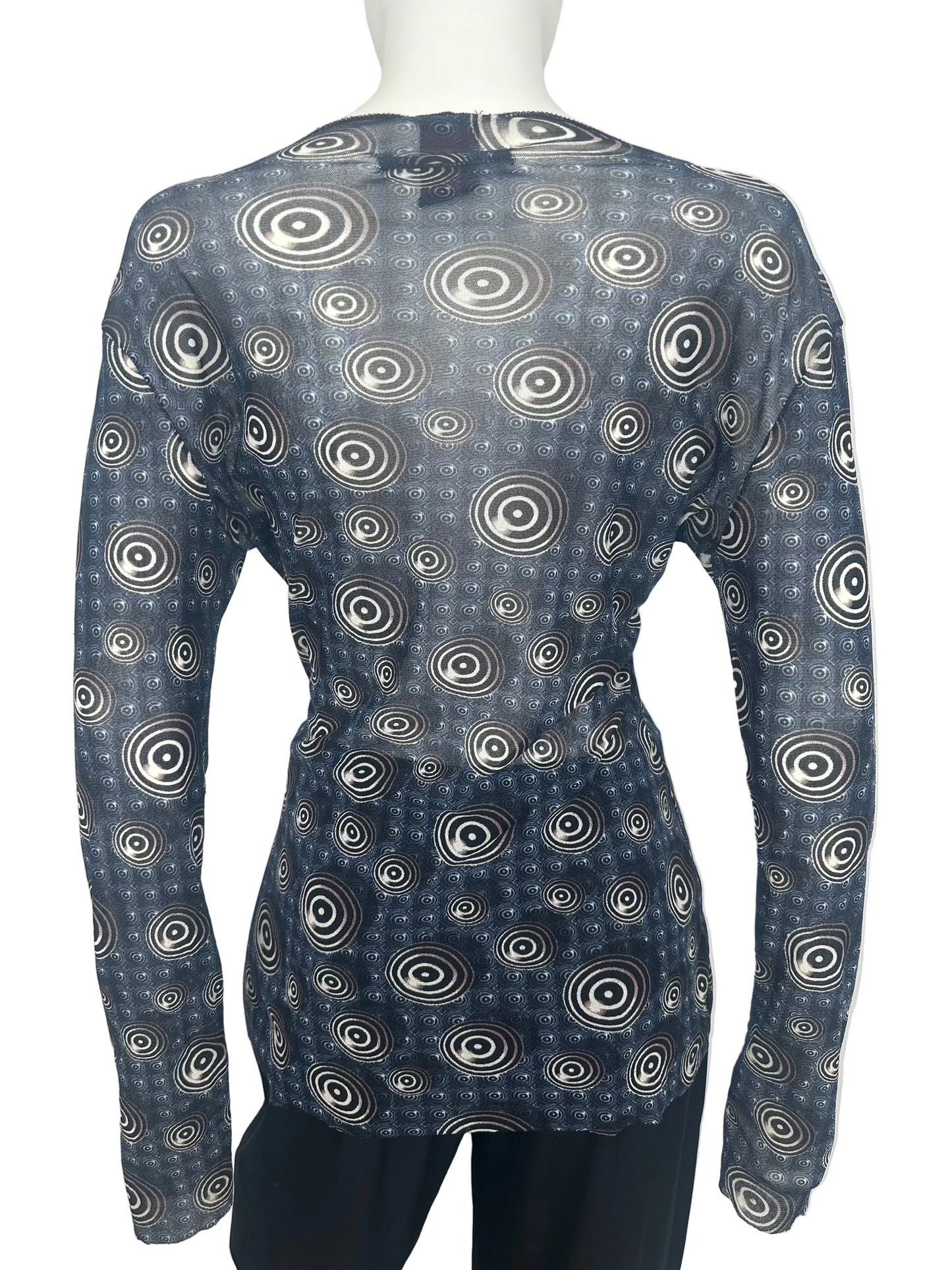 Abstract print top with circle pattern on a mannequin