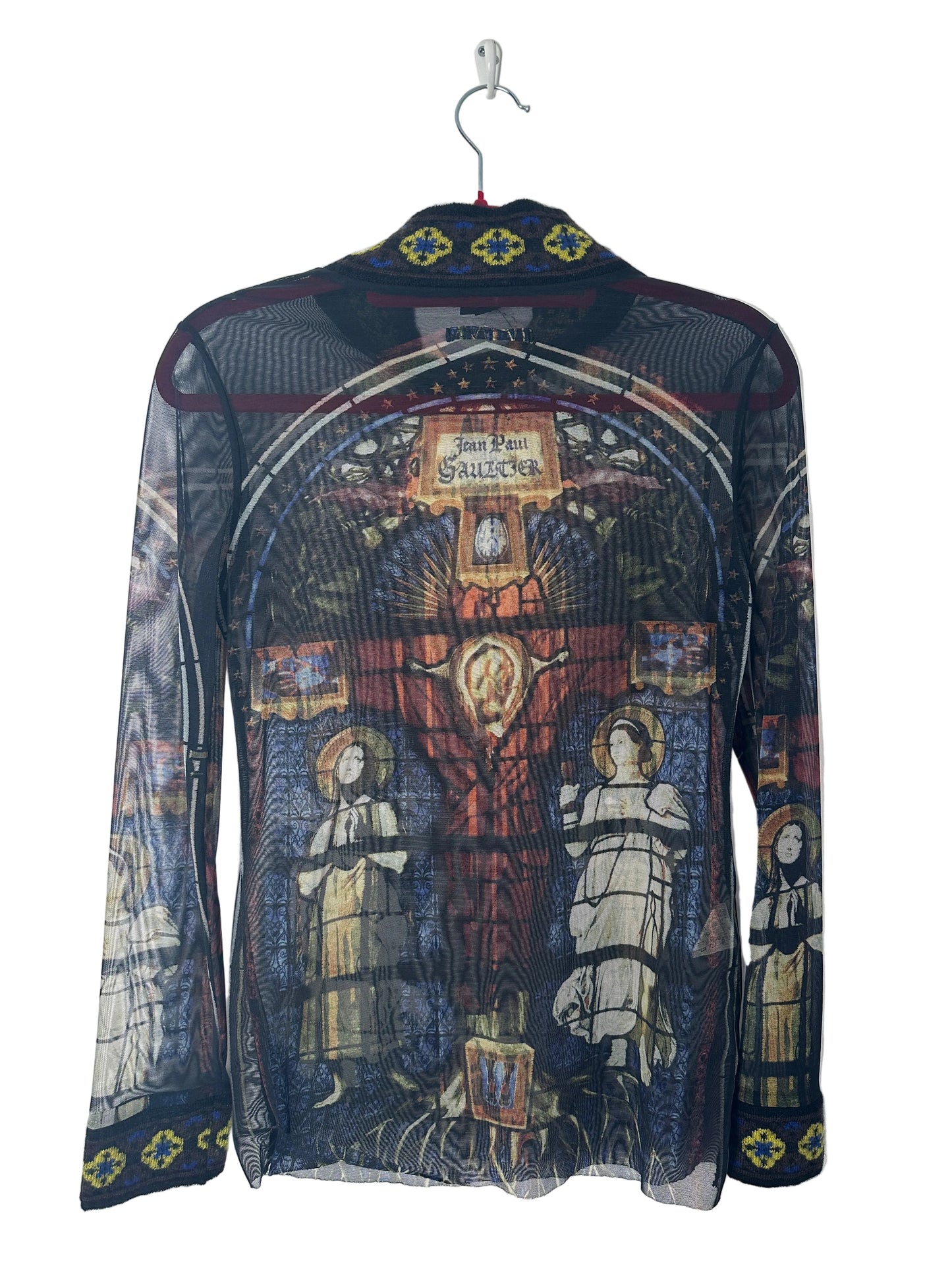 Decorative garment with intricate patterns on a white background