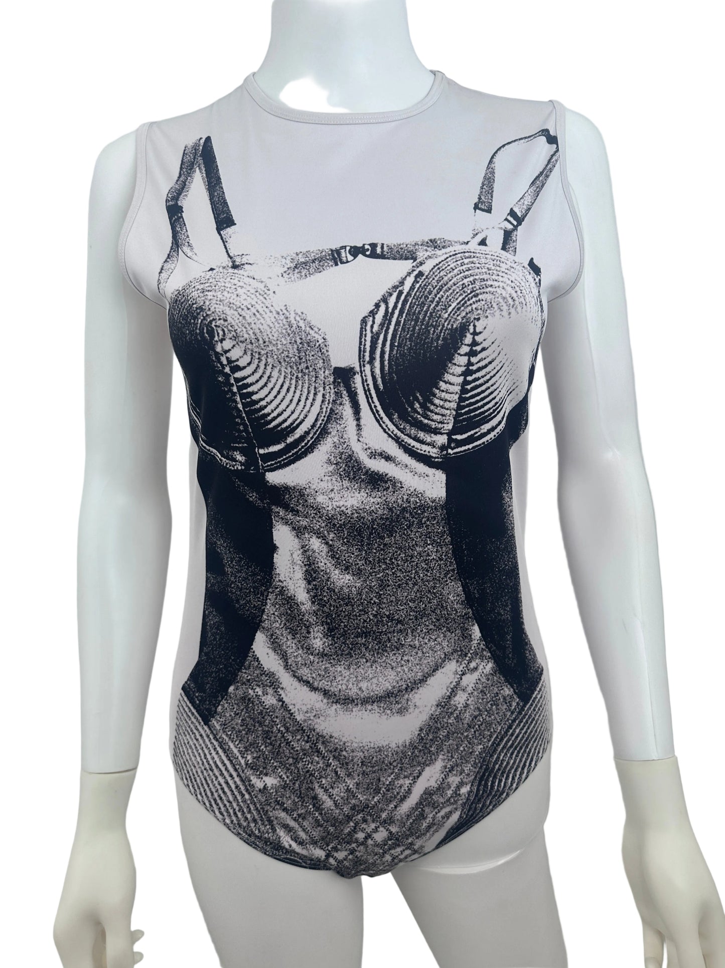A white sleeveless top displayed on a white mannequin torso, featuring a large black and gray graphic print of a bra on the front.