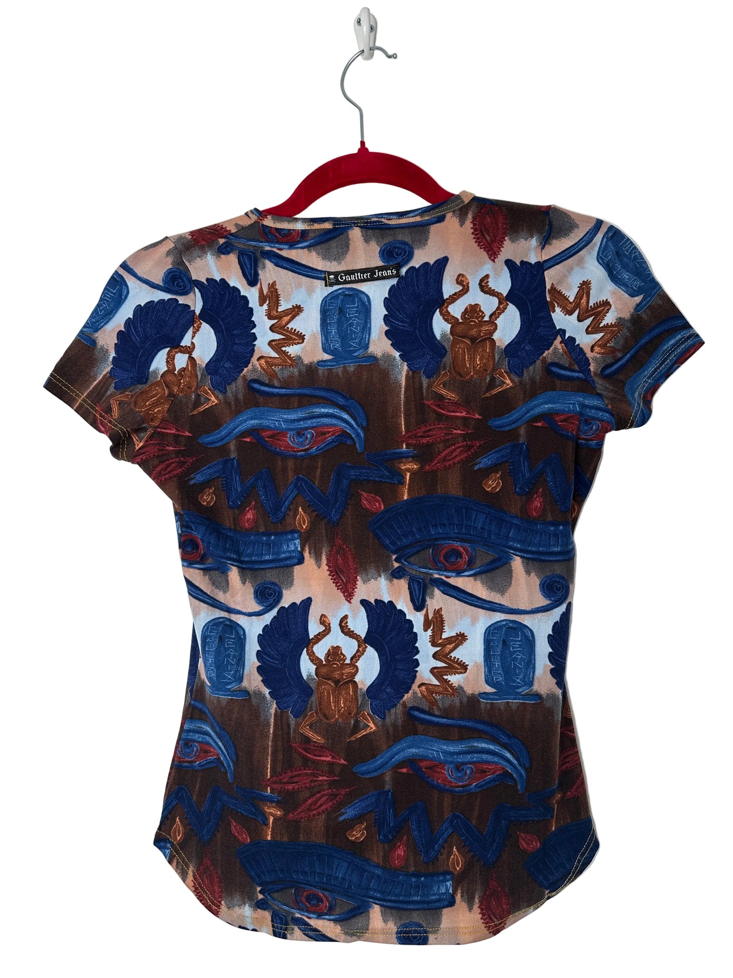 A top with intricate patterns on a white background