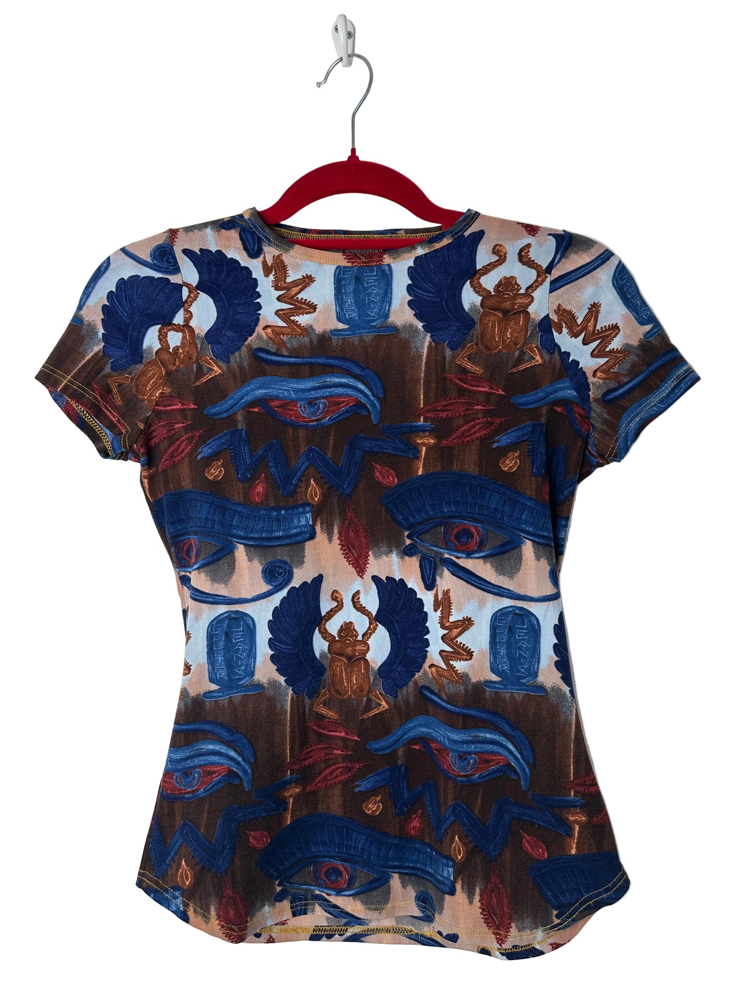 Colourful patterned top on a white background