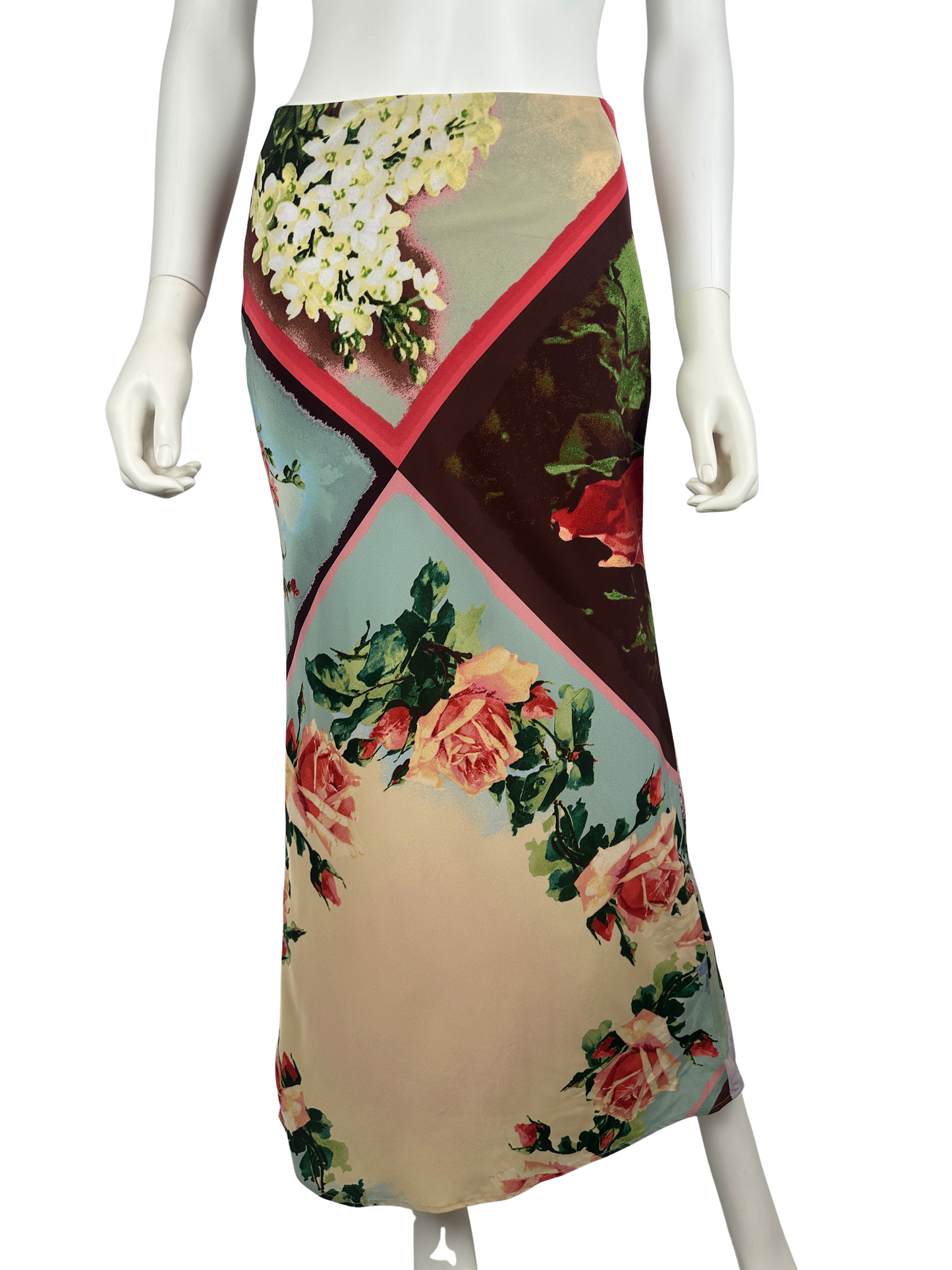Mannequin wearing a floral patterned skirt on a white background