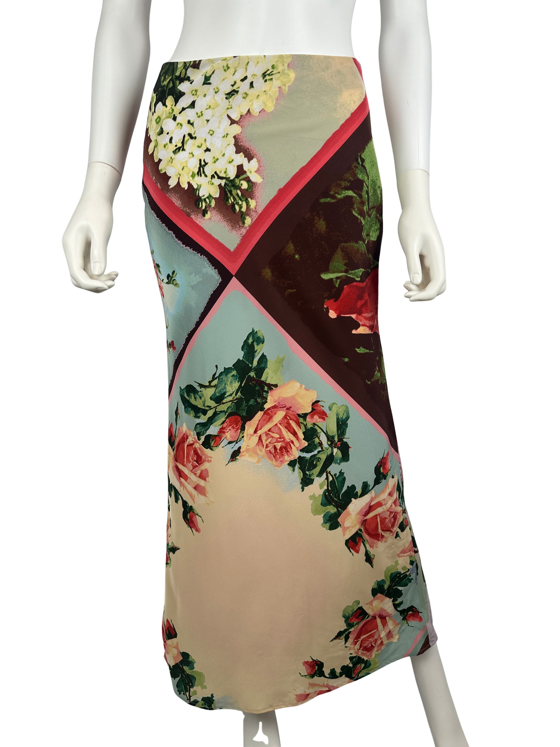 Mannequin wearing a floral patterned skirt on a white background