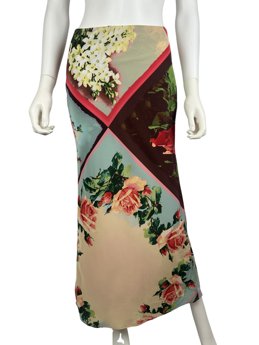 Mannequin wearing a floral patterned skirt on a white background