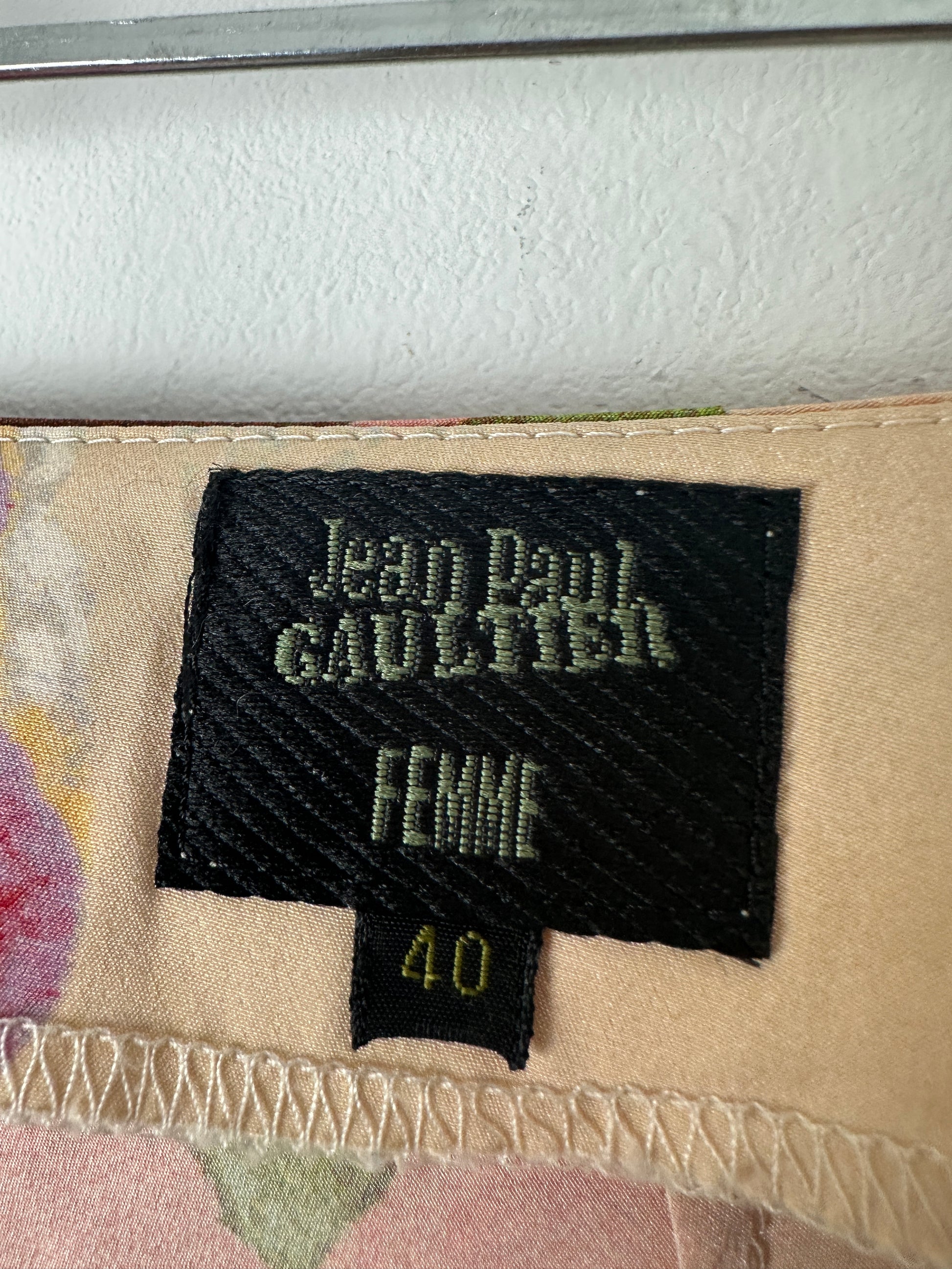 Close-up of a label on a piece of clothing with text and numbers.