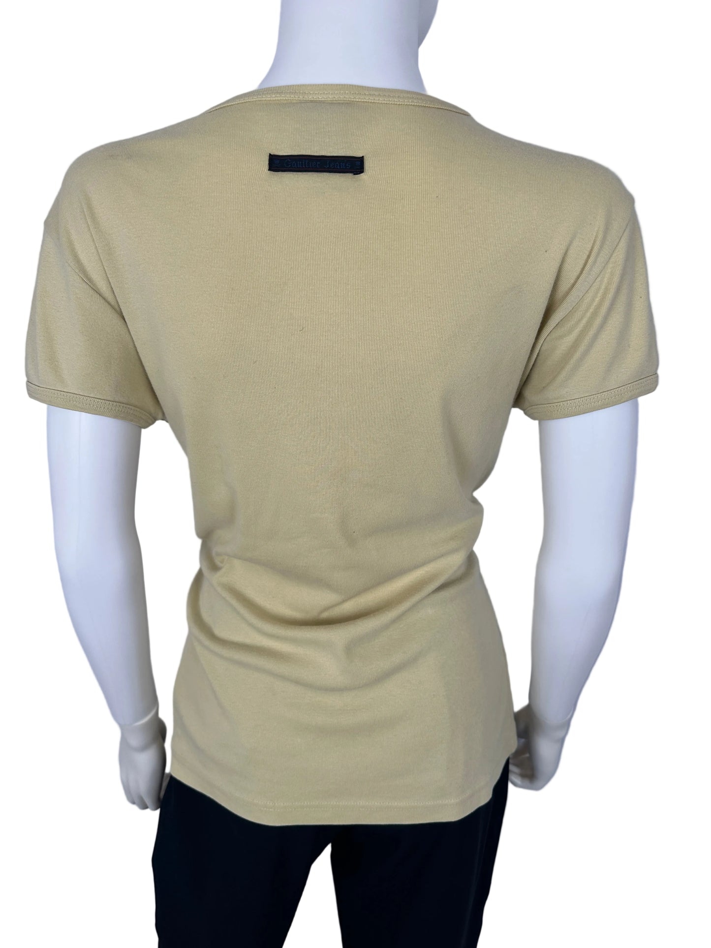 Beige top on a mannequin against a white background